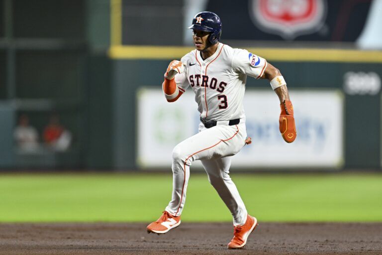 Houston Astros shortstop Jeremy Pena (3) scores off of a single from third baseman Isaac Paredes (15) during in the first inning against the Philadelphia Phillies at Daikin Park.