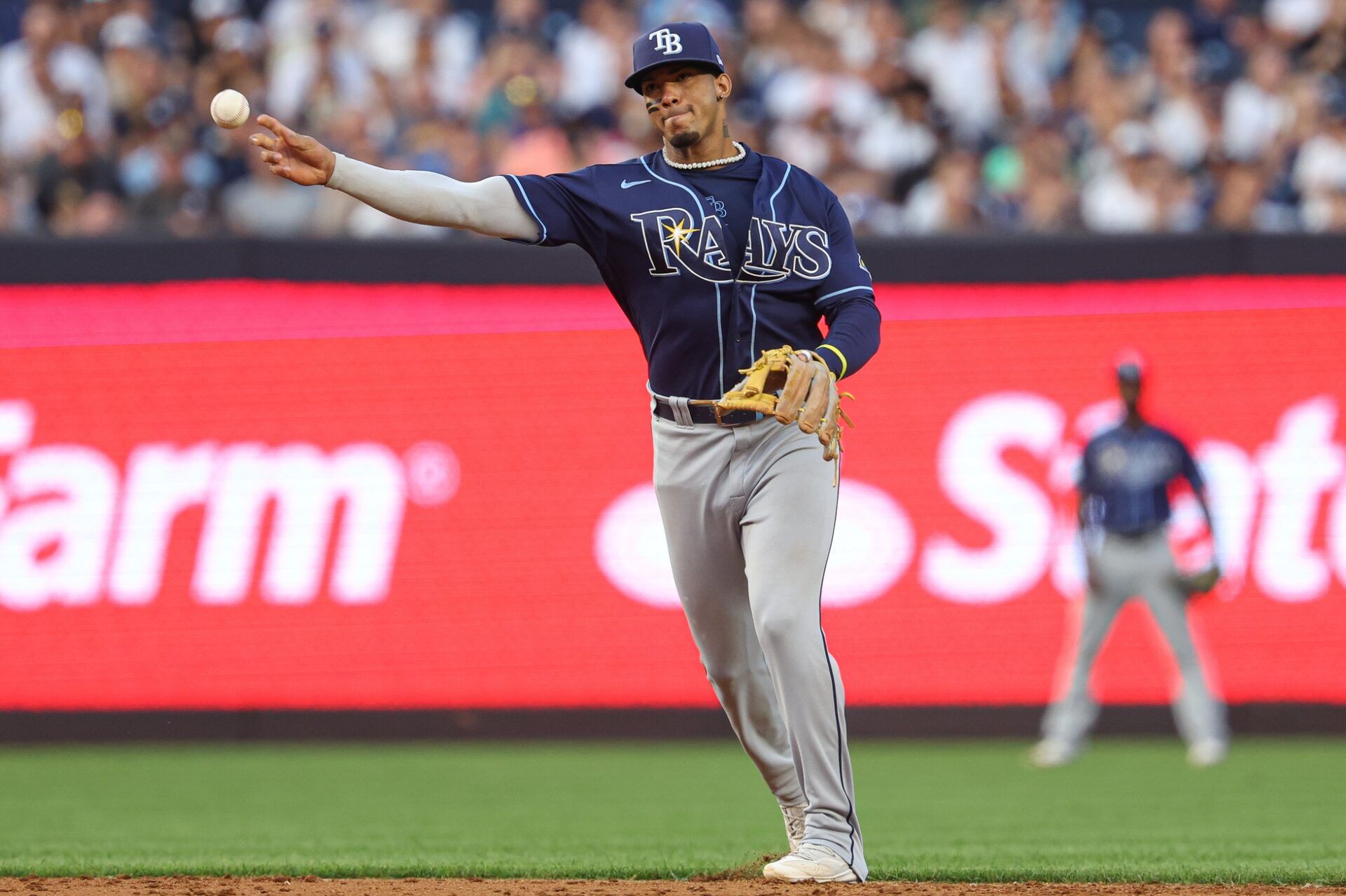 Tampa Bay Rays shortstop Wander Franco (5) throws the ball to first base for an out during the second inning against the New York Yankees at Yankee Stadium.
