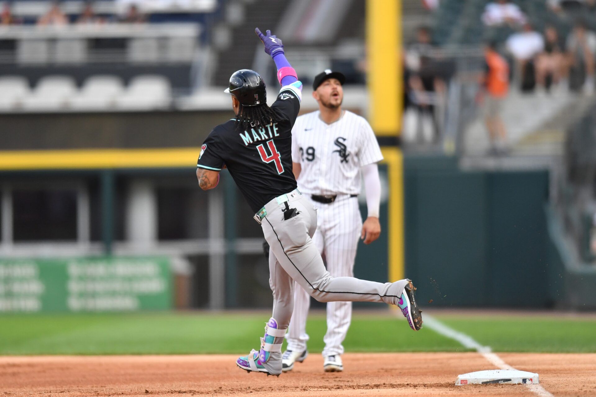 Arizona Diamondbacks second baseman Ketel Marte (4) rounds the bases and celebrates his home run during the first inning against the Chicago White Sox at Rate Field.