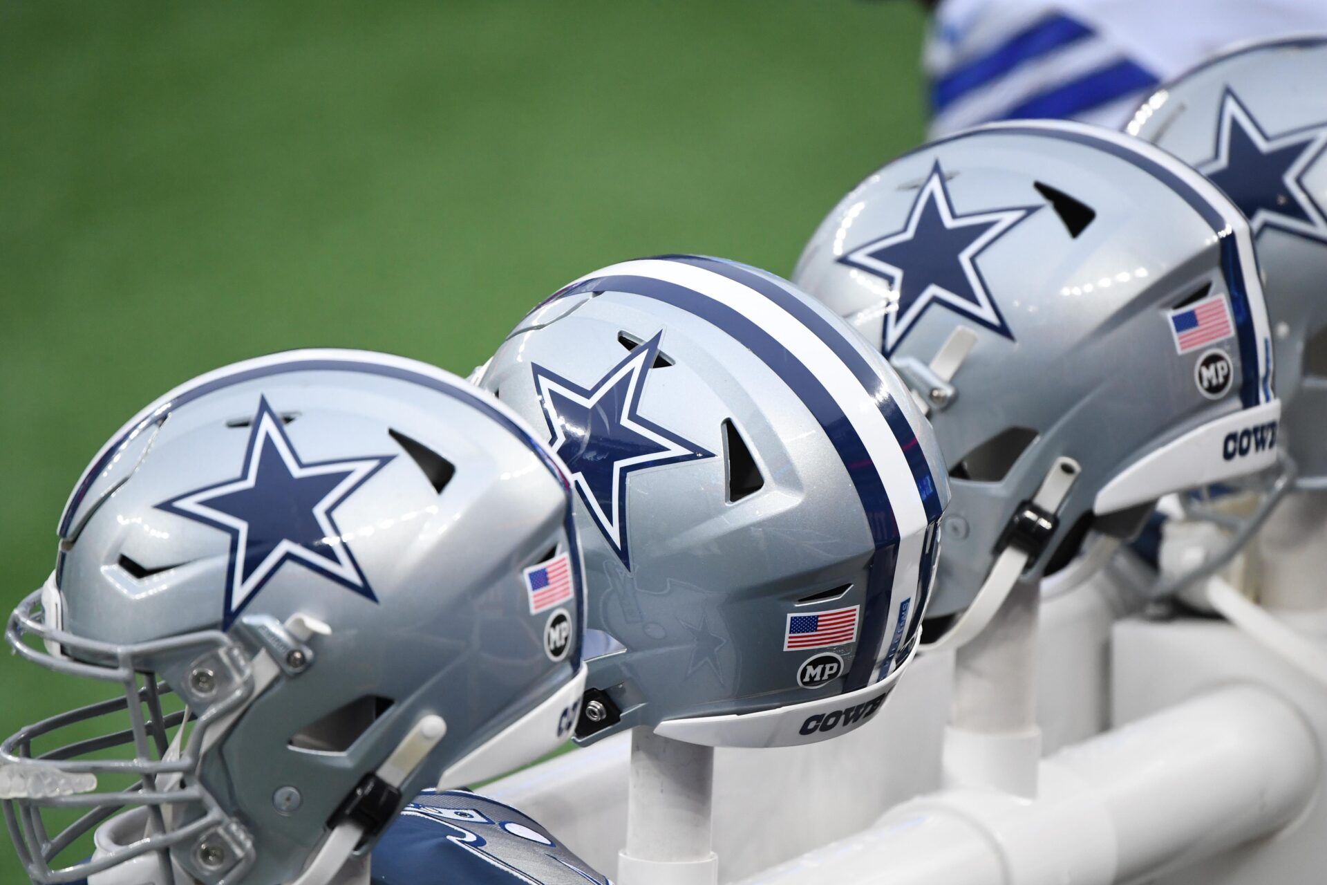 Dallas Cowboys helmets are heated on the benches against the New York Giants in the first half at MetLife Stadium.