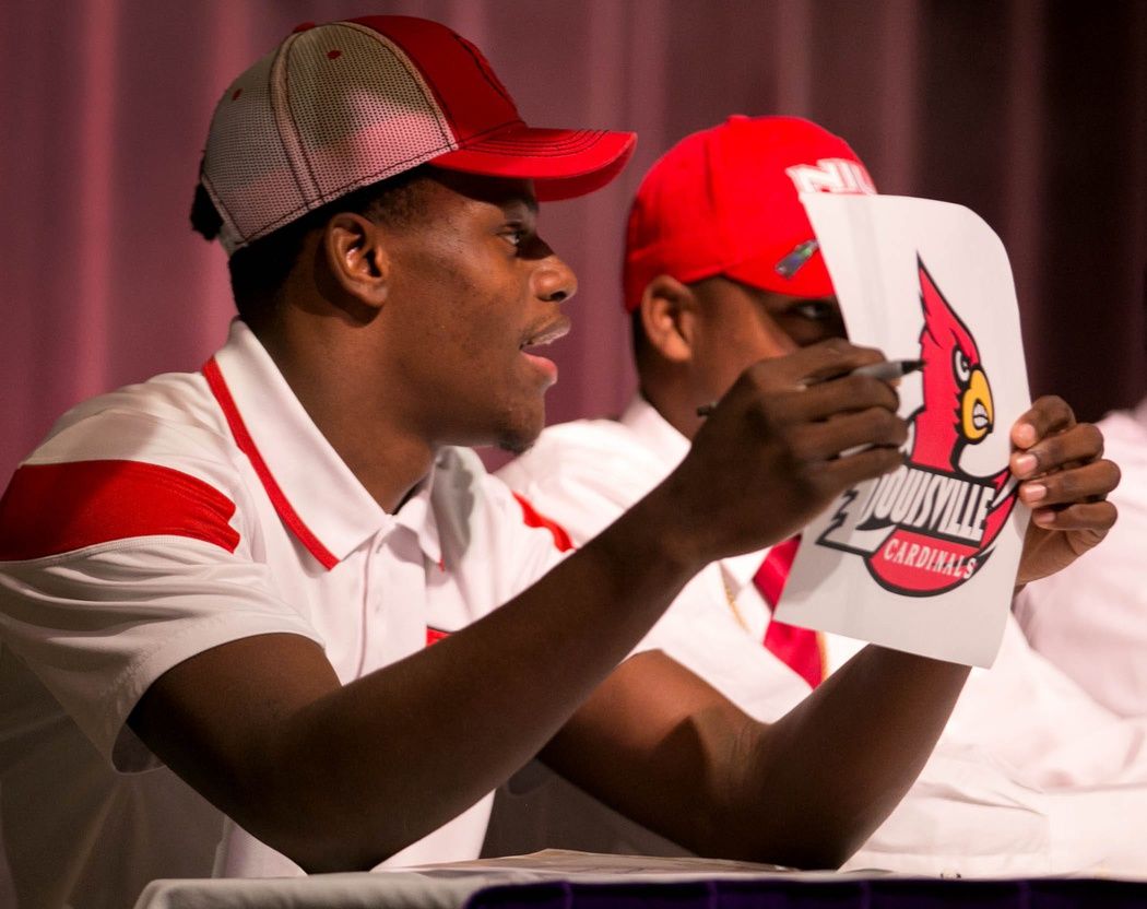 Boynton Beach High School standout Lamar Jackson announces that he is signing with Louisville on National Signing Day on February 4, 2015 (Allen Eyestone / The Palm Beach Post)