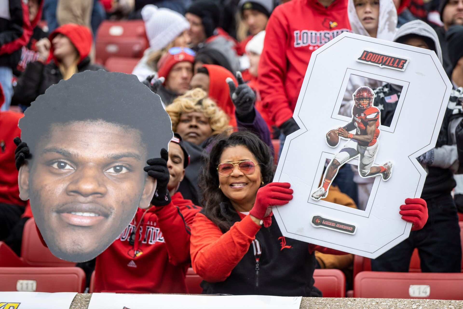 Juanita Turpin, right, and Zion Turpin show their love for Lamar Jackson on Saturday before Jackson's number 8 was officially retired by the University of Louisville. Nov. 13, 2021

As 0364lamar5