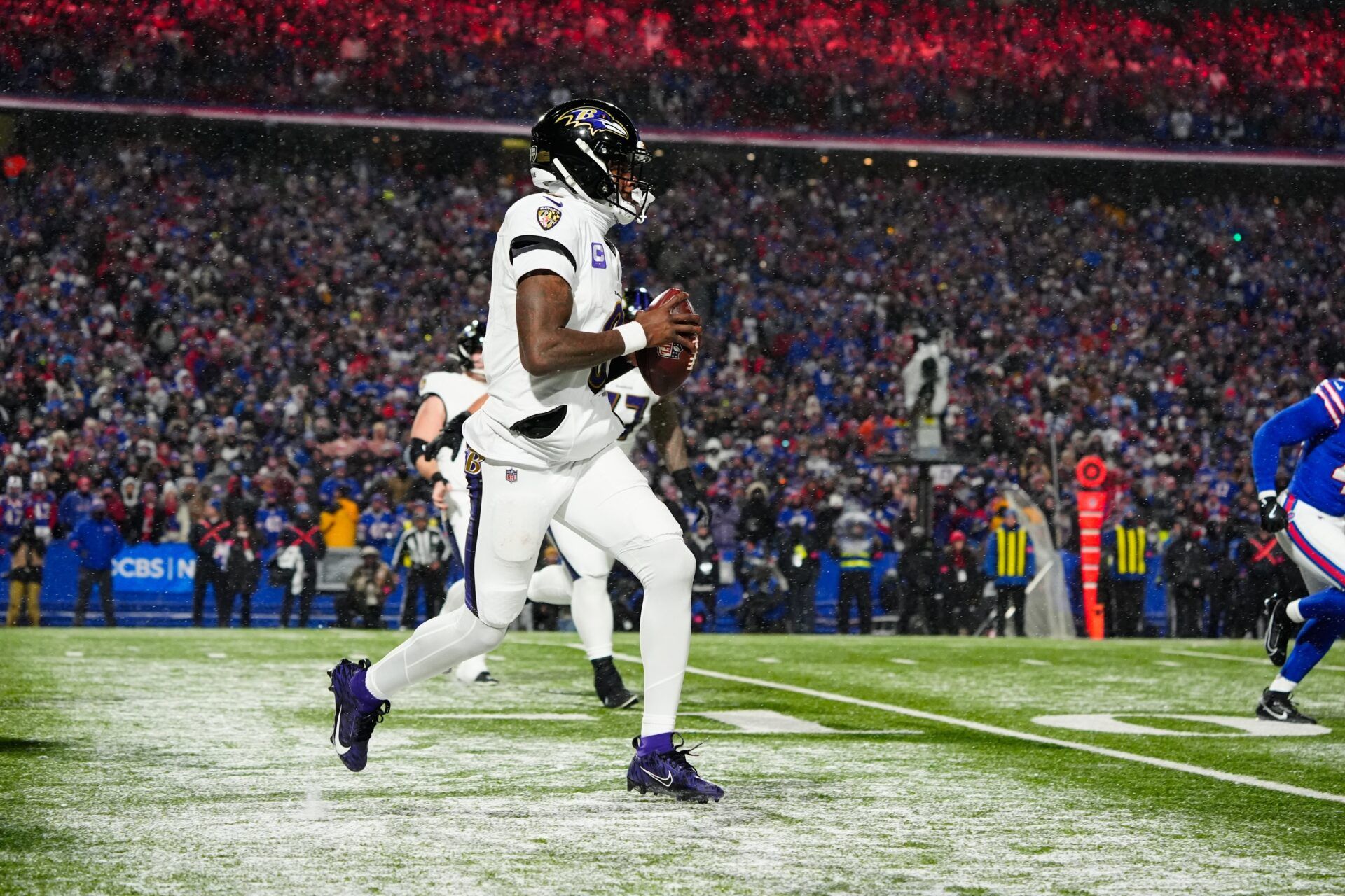 Baltimore Ravens quarterback Lamar Jackson (8) runs the ball during the fourth quarter against the Buffalo Bills in a 2025 AFC divisional round game at Highmark Stadium.