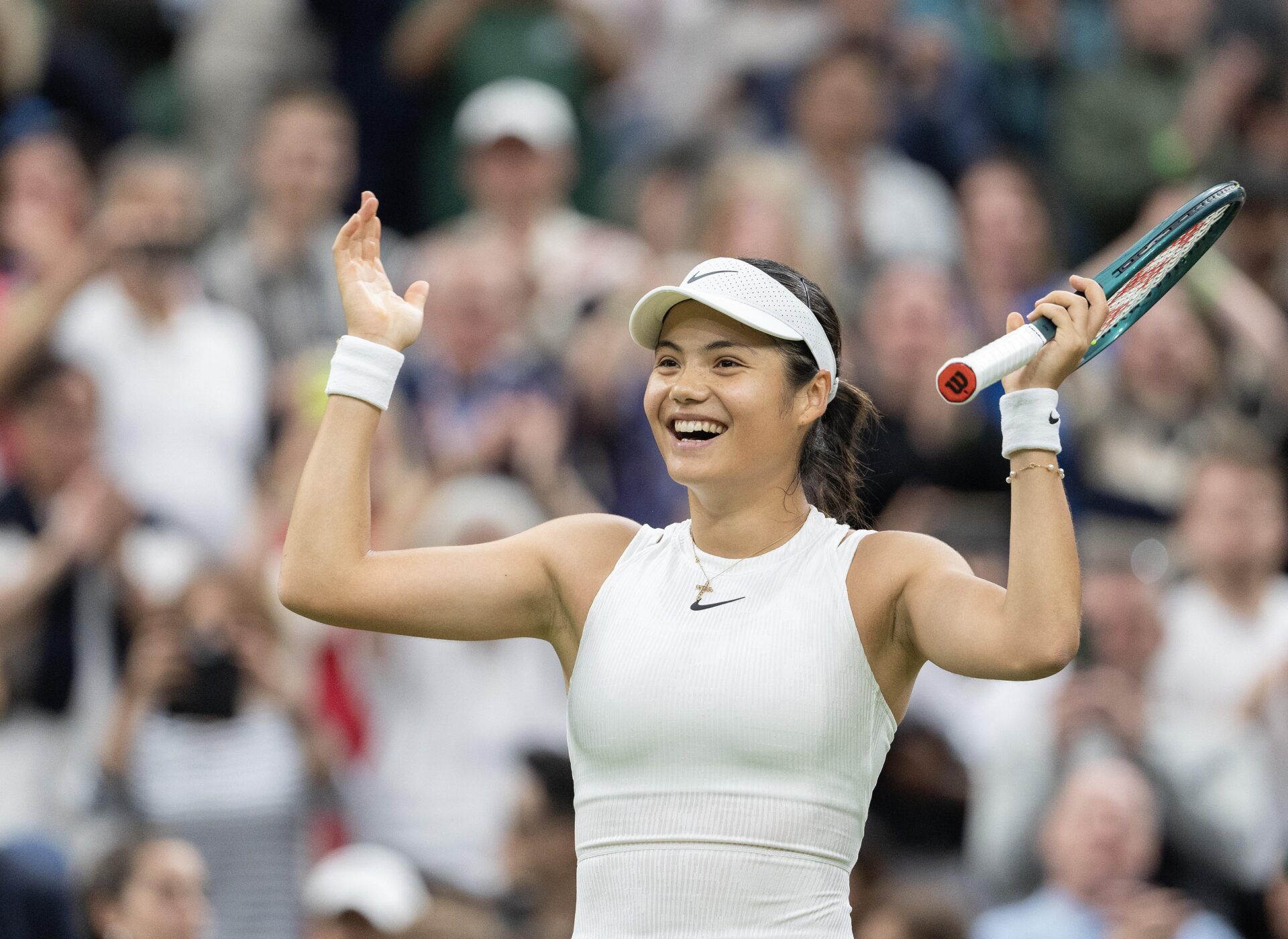Emma Raducanu of Great Britain celebrates winning her match against Maria Sakkara of Greece (not shown) on day five of The Championships at All England Lawn Tennis and Croquet Club.