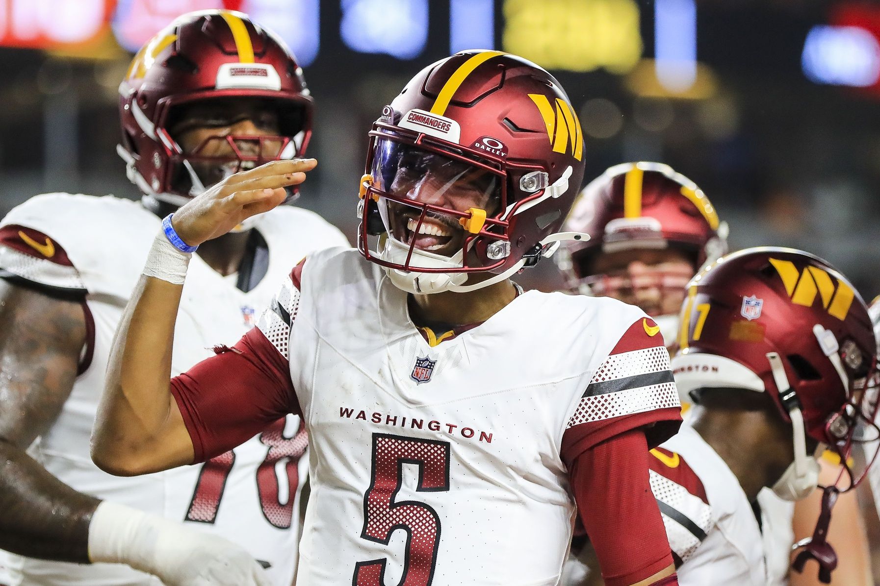 Washington Commanders quarterback Jayden Daniels (5) reacts after scoring a touchdown against the Cincinnati Bengals in the first half at Paycor Stadium.