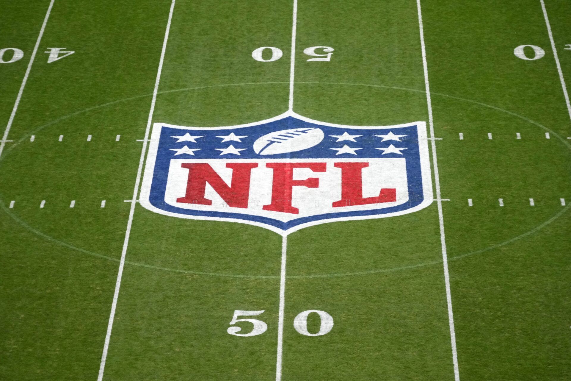 The NFL shield logo at midfield during the 2024 NFL Munich Game at Allianz Arena.
