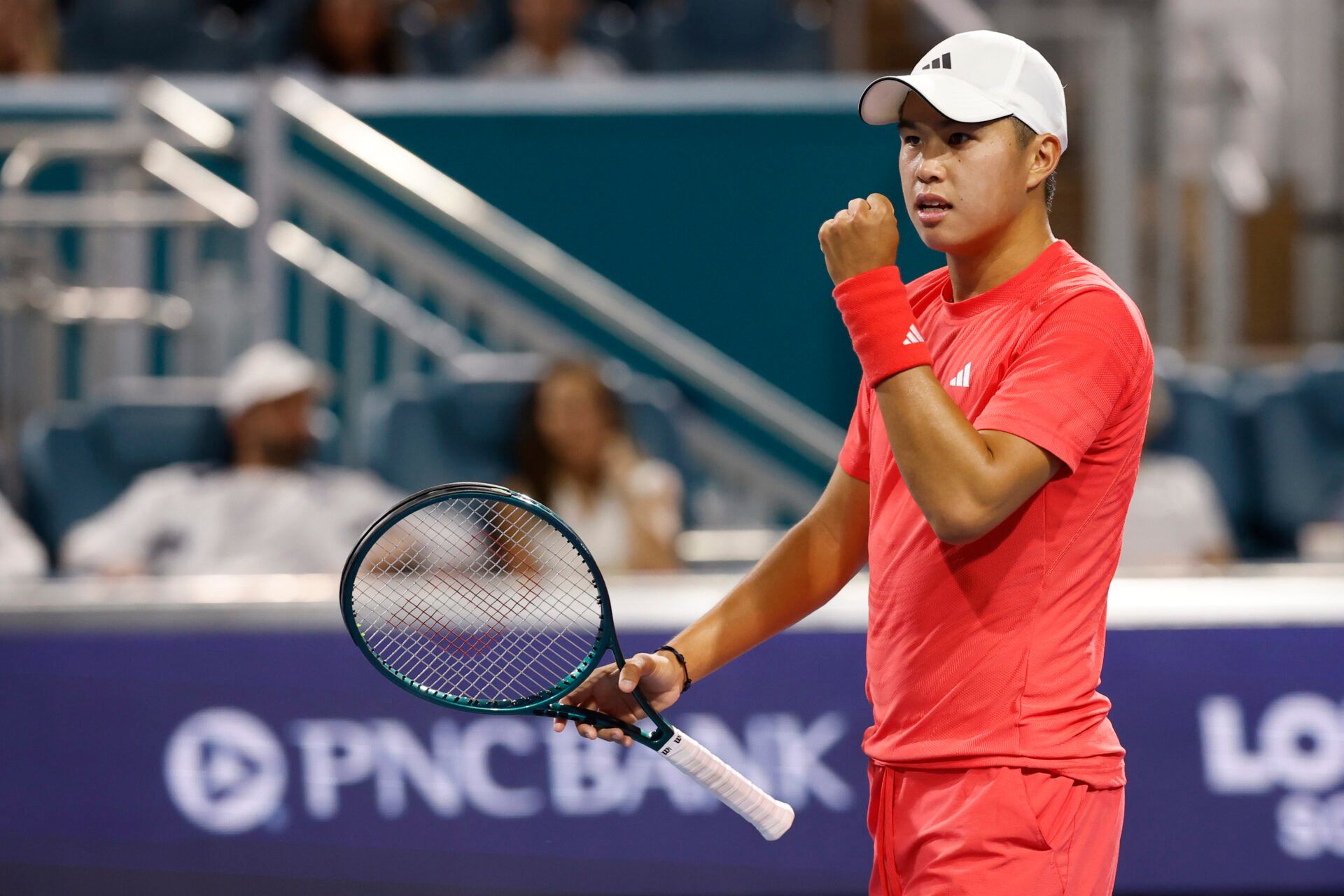 Learner Tien (USA) reacts after winning the first set tie-breaker against Joao Fonseca (BRA)(not pictured) on day three of the Miami Open at Hard Rock Stadium.