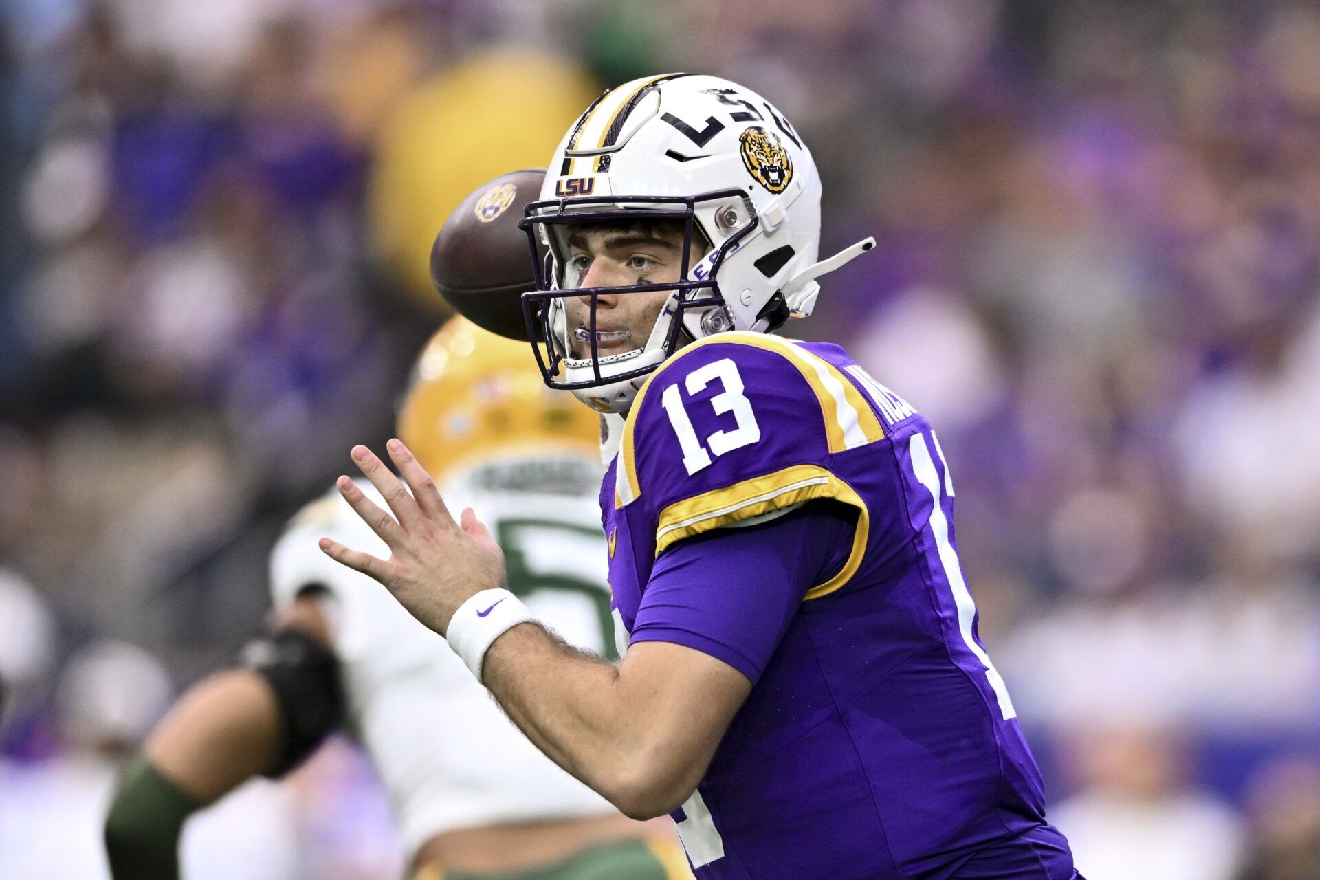 LSU Tigers quarterback Garrett Nussmeier (13) throws a pass during the first quarter against the Baylor Bears at NRG Stadium.