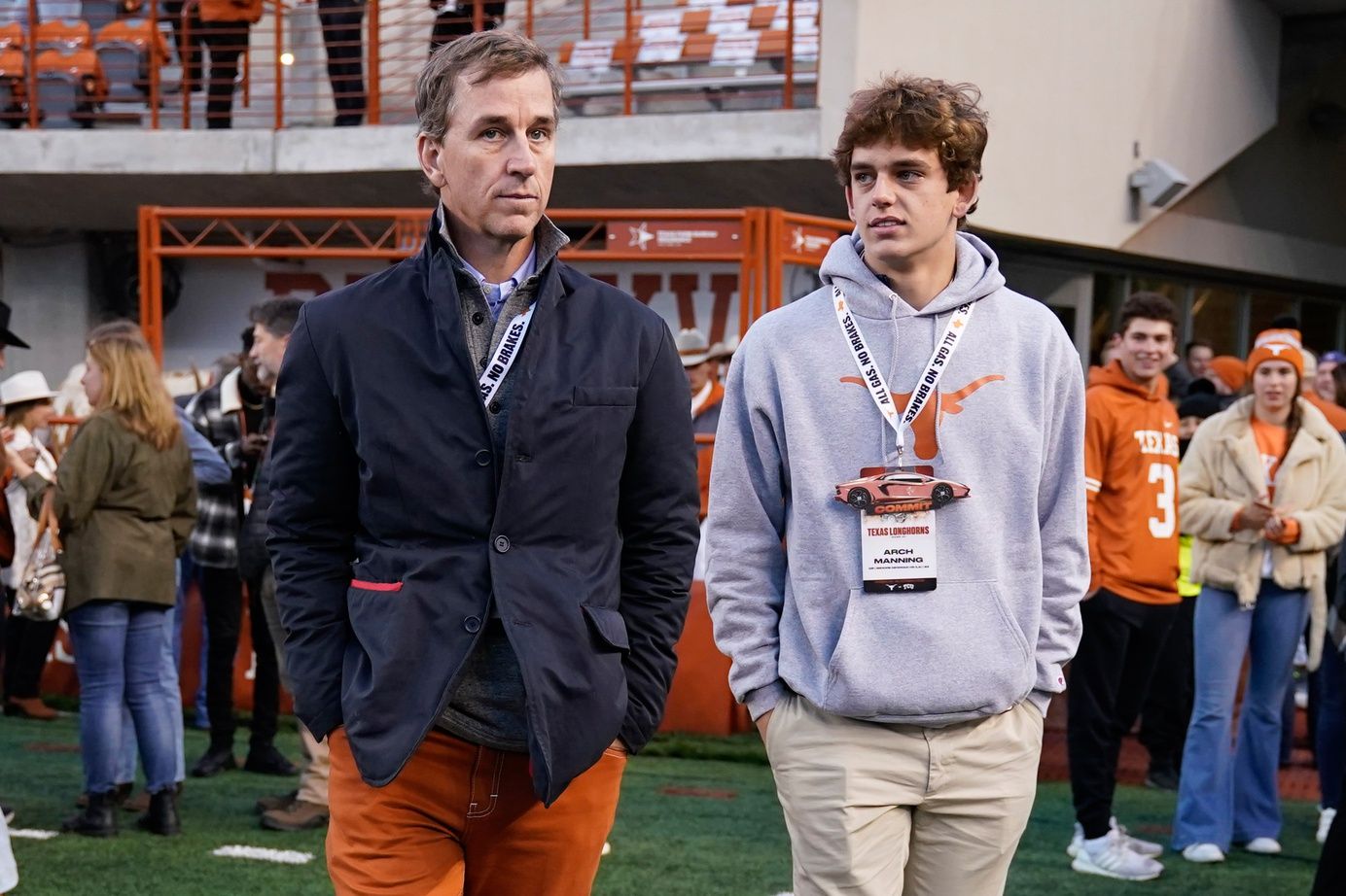 Texas Longhorns quarterback recruit Arch Manning along with his father Cooper Manning on the sidelines before the game against the Texas Christian Horned Frogs at Darrell K Royal-Texas Memorial Stadium.