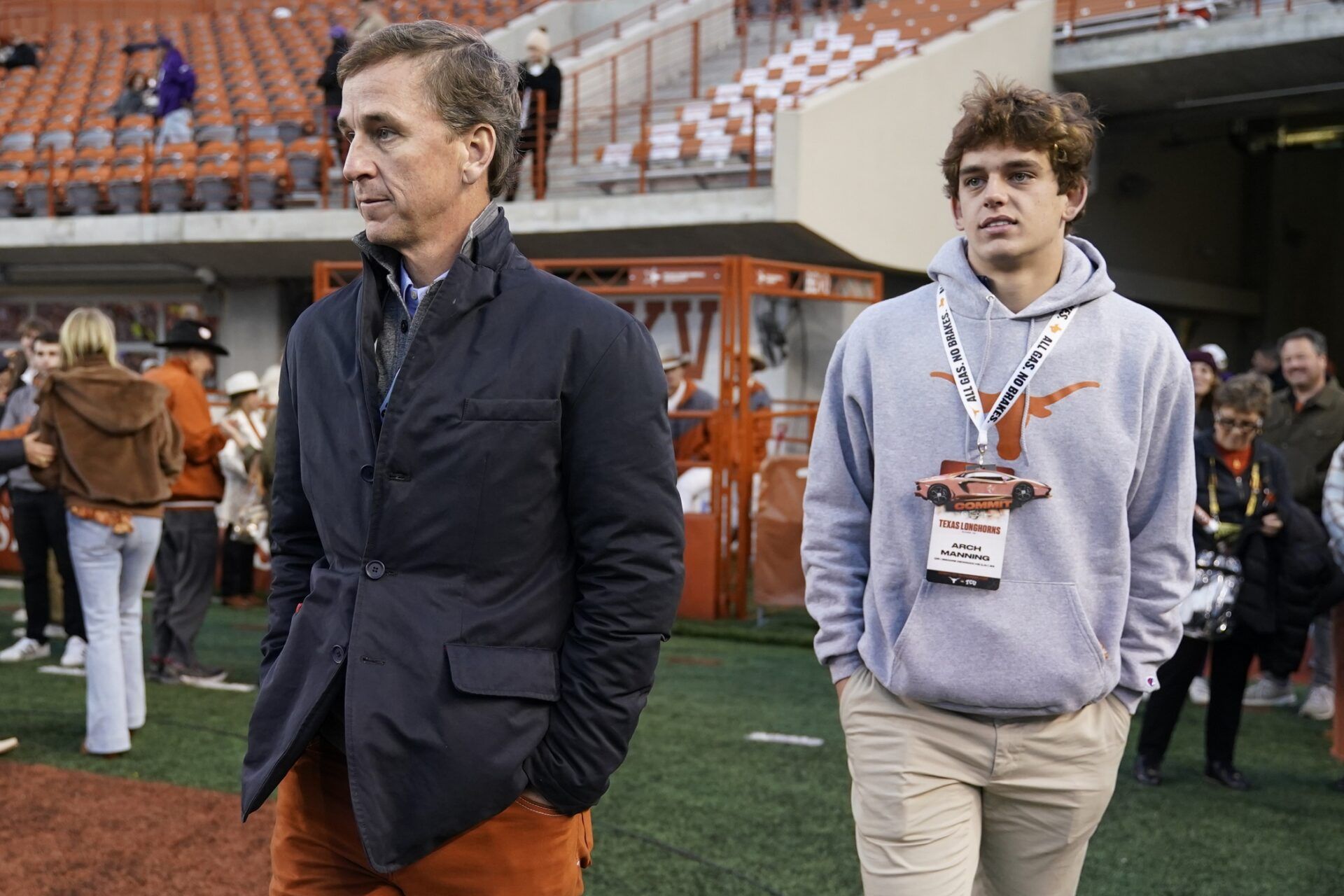 Texas Longhorns quarterback recruit Arch Manning with his father Cooper Manning on the sidelines before the game against the Texas Christian Horned Frogs at Darrell K Royal-Texas Memorial Stadium.