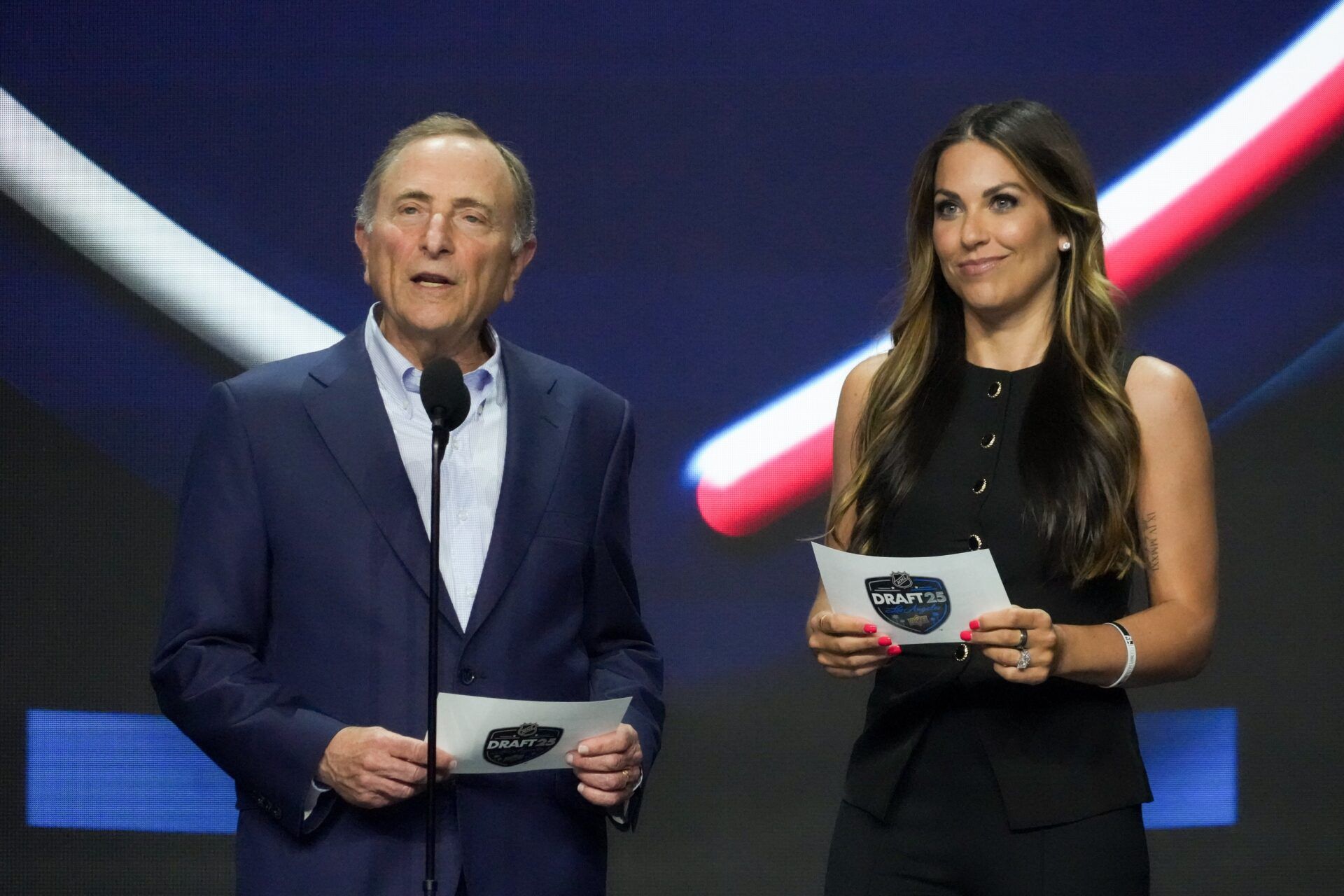 NHL Commissioner Gary Bettman and Meredith Gaudreau announce the 20th overall pick for the Columbus Blue Jackets in the first round of the 2025 NHL Draft at Peacock Theater.