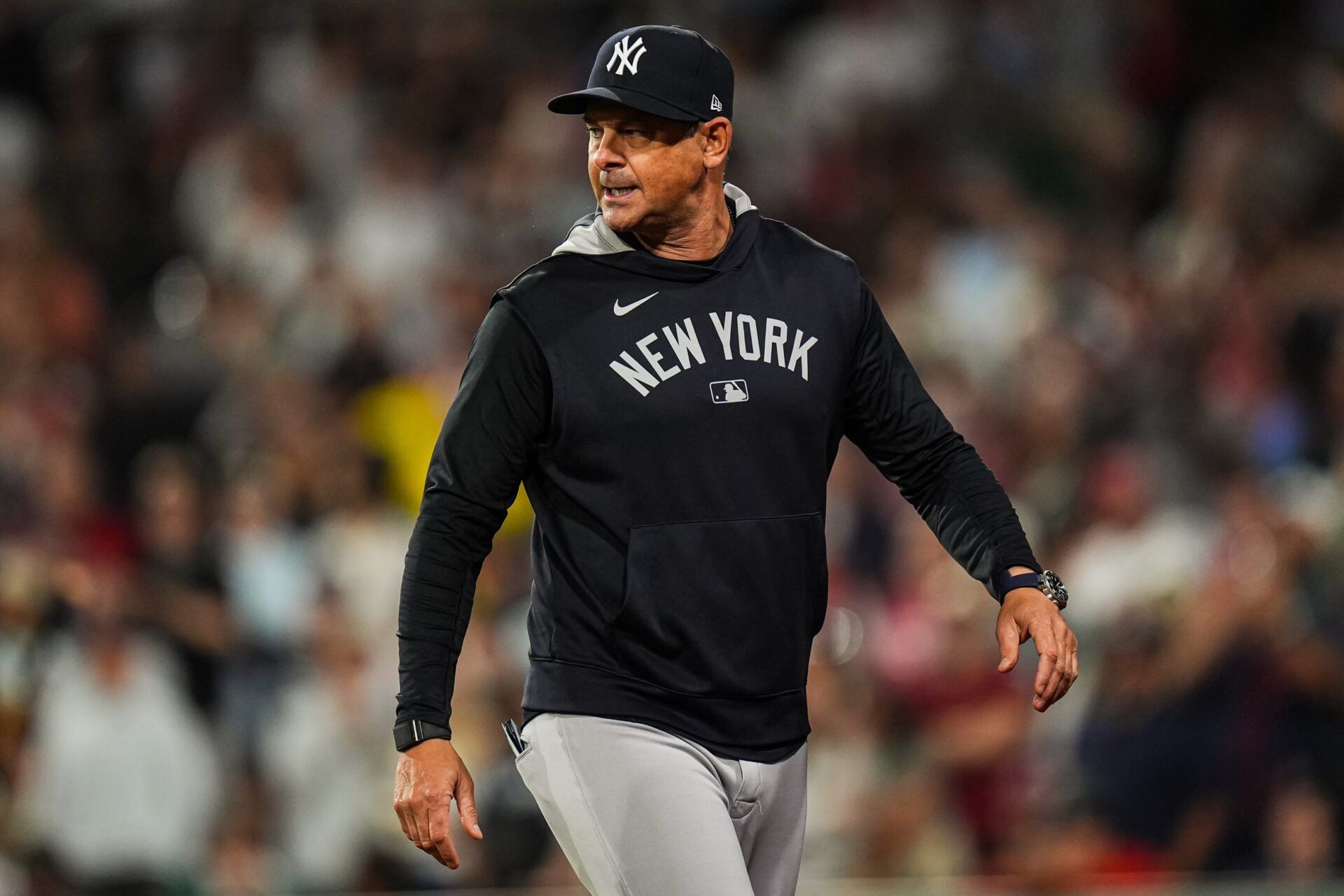 New York Yankees manager Aaron Boone (17) has words with the officials as they take on the Boston Red Sox in the tenth inning at Fenway Park.