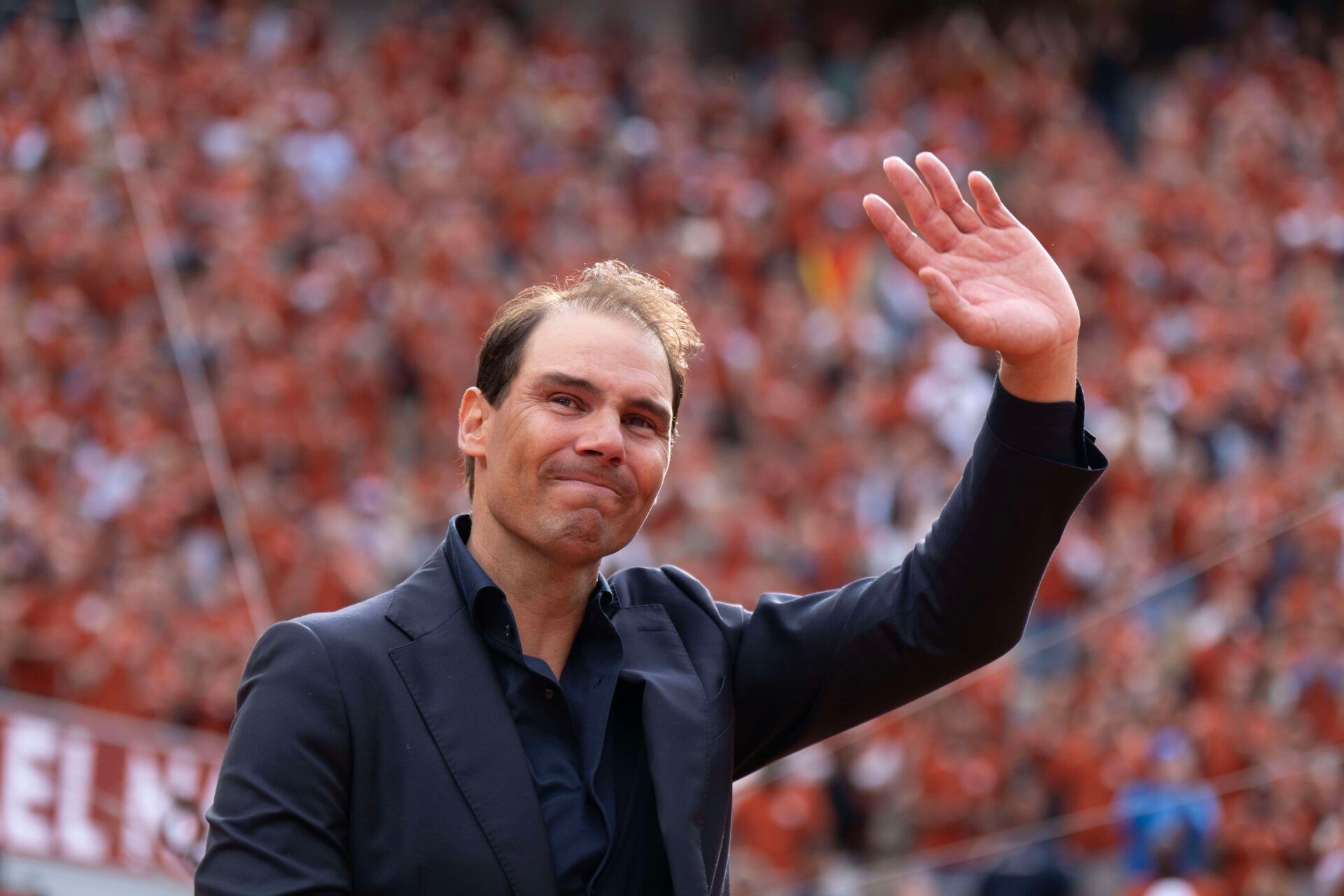 Rafael Nadal of Spain does a final walk around the court during the presentation ceremony paying tribute to his career on a packed Court Philippe Chatrier Courtday on day one at Roland Garros Stadium.