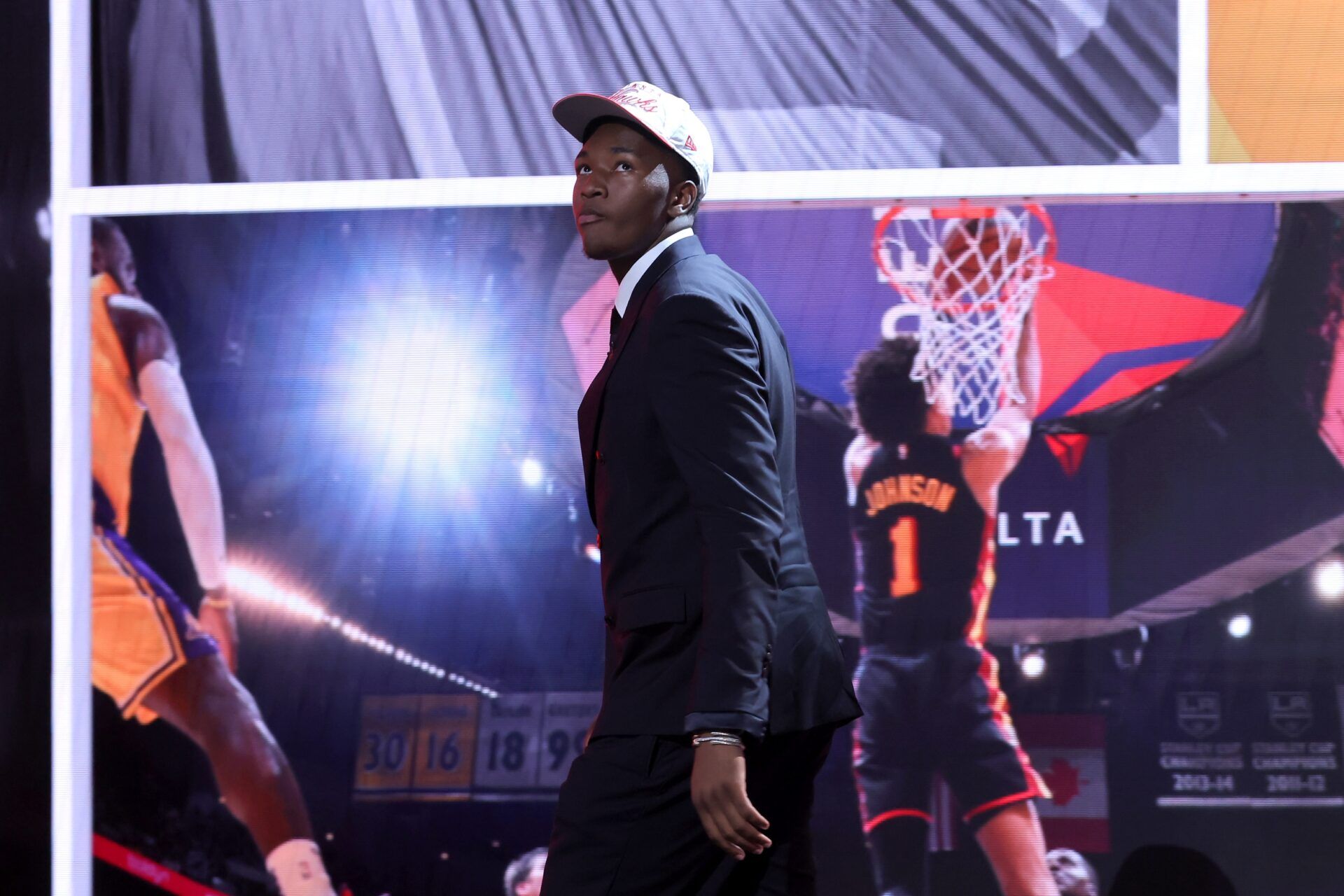 Derik Queen reacts on stage after being selected as the 13th pick by the Atlanta Hawks in the first round of the 2025 NBA Draft at Barclays Center.