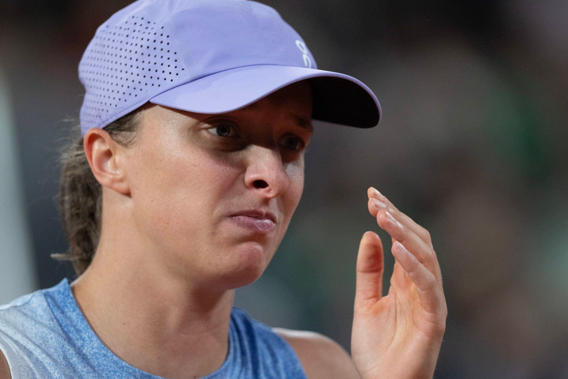Iga Swiatek of Poland reacts to a point during her match against Aryna Sabalenka on day 12 at Roland Garros Stadium.
