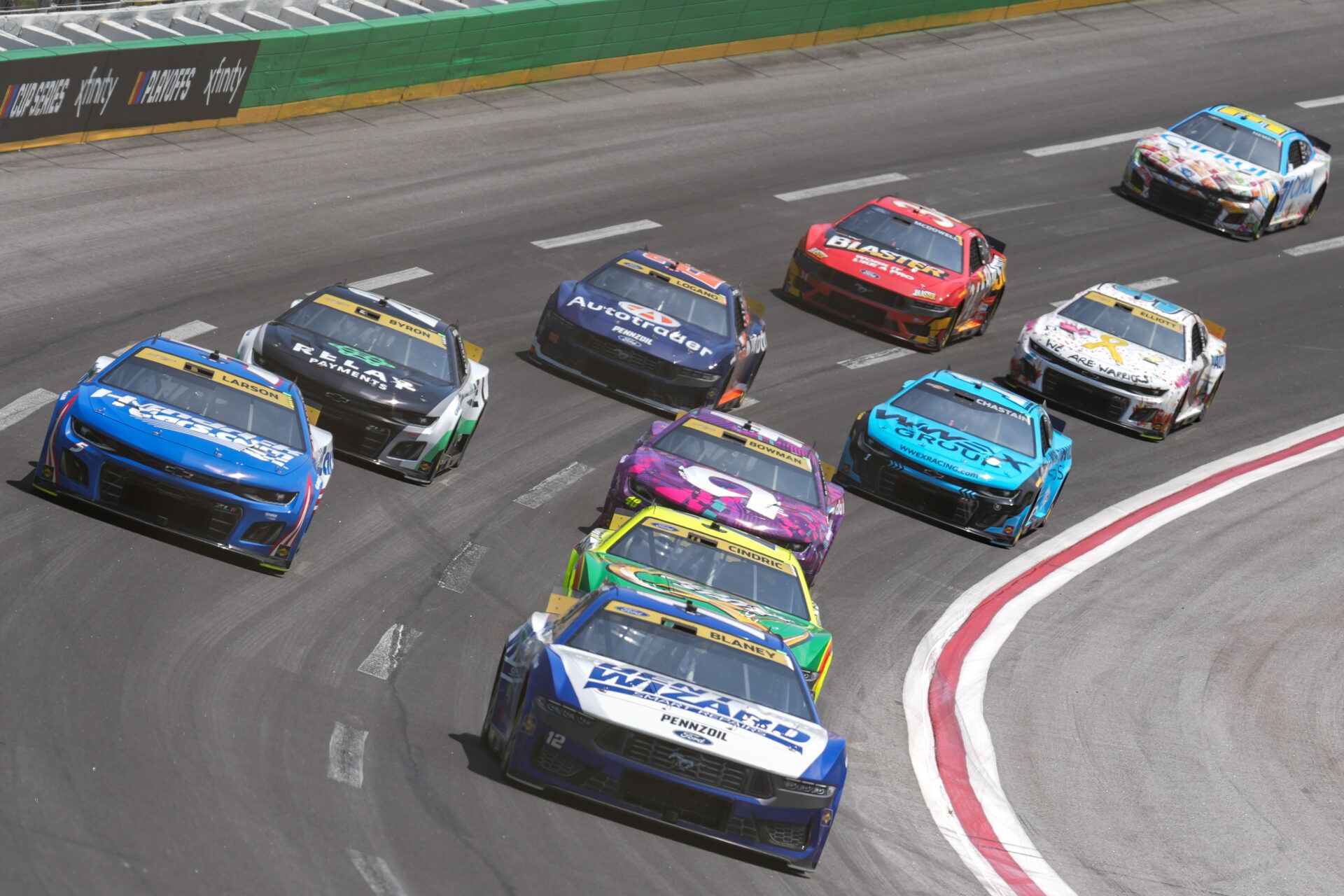 NASCAR Cup Series driver Ryan Blaney (12) leads the pack going into turn four at Atlanta Motor Speedway.