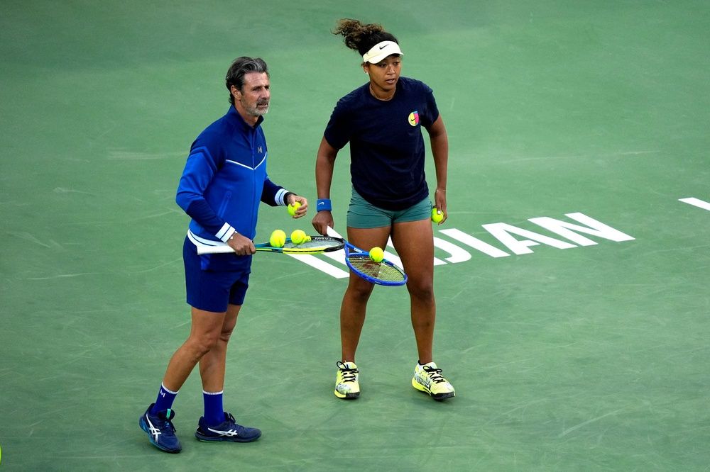 Tennis coach Patrick Mouratoglou, left, coaches Naomi Osaka during a practice session ahead of the main draw during the BNP Paribas Open at the Indian Wells Tennis Garden in Indian Wells, Calif., on Sunday, March 2, 2025.