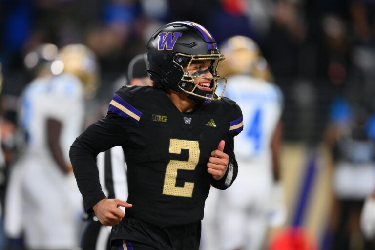 Washington Huskies quarterback Demond Williams Jr. (2) smiles after throwing a touchdown against the UCLA Bruins during the second half at Alaska Airlines Field at Husky Stadium.