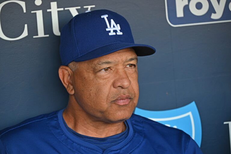 Los Angeles Dodgers manager Dave Roberts (30) talks with the media before a game against the Kansas City Royals at Kauffman Stadium.