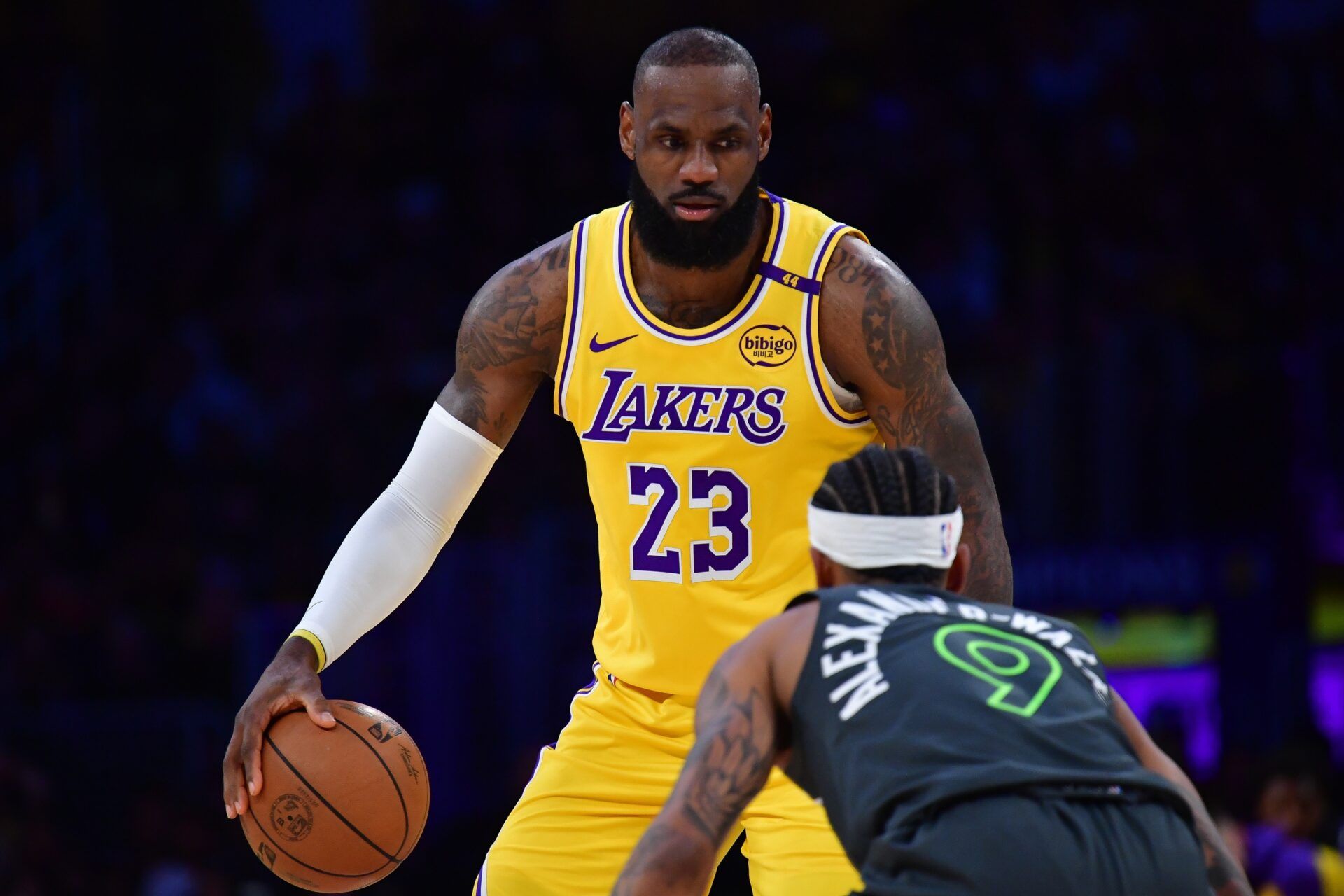 Los Angeles Lakers forward LeBron James (23) controls the ball against Minnesota Timberwolves guard Nickeil Alexander-Walker (9) during the first half in game five of first round for the 2025 NBA Playoffs at Crypto.com Arena.