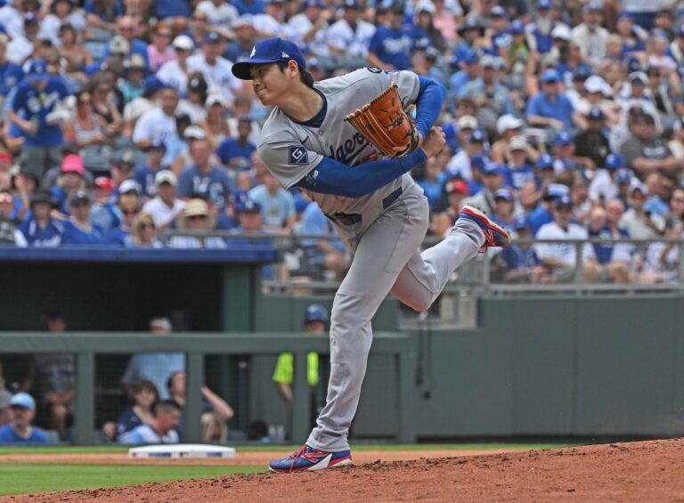 Los Angeles Dodgers designated hitter Shohei Ohtani (17) throws a pitch in the second inning against the Kansas City Royals  at Kauffman Stadium.