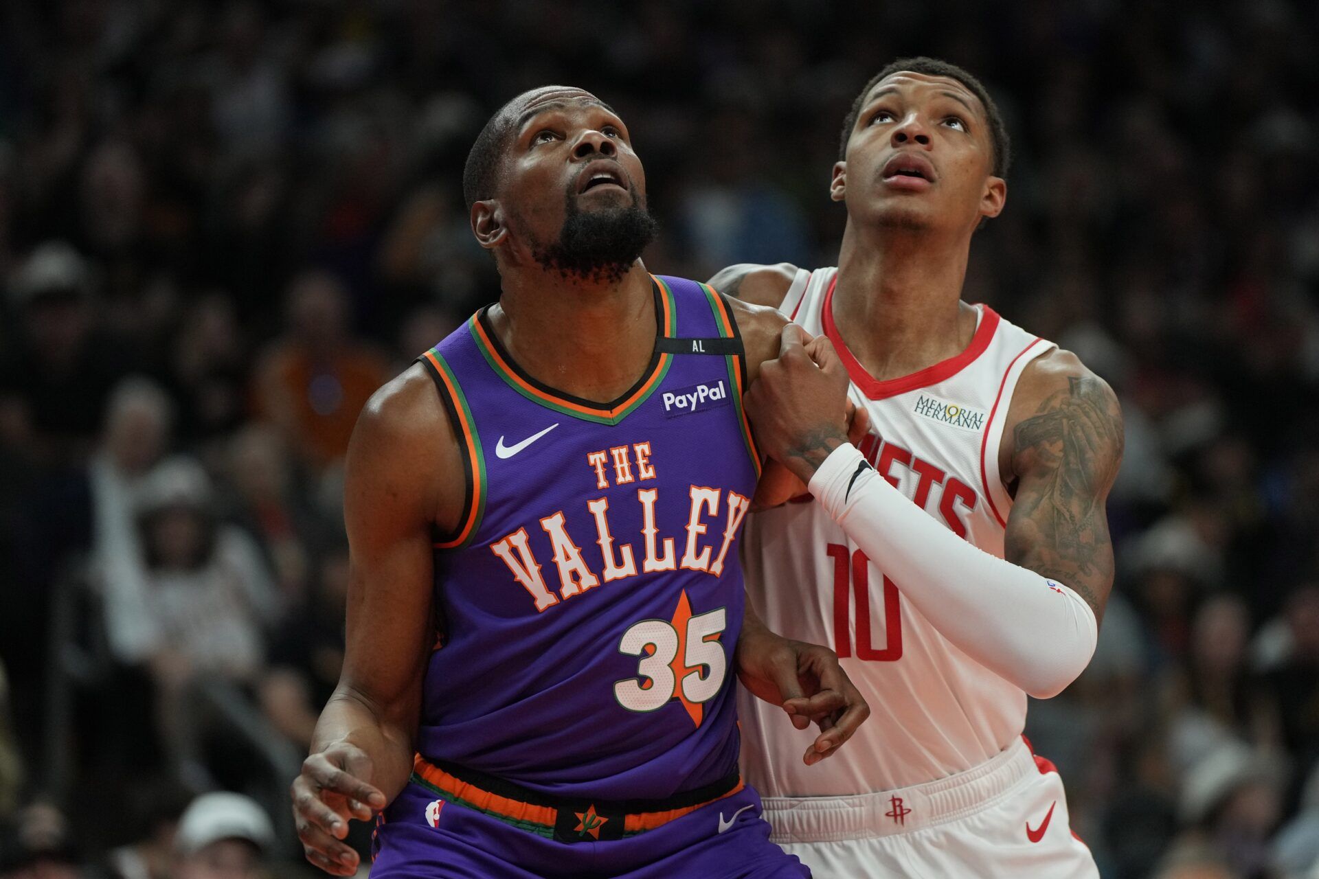 Phoenix Suns forward Kevin Durant (35) and Houston Rockets forward Jabari Smith Jr. (10) fight for position in the first half at Footprint Center.
