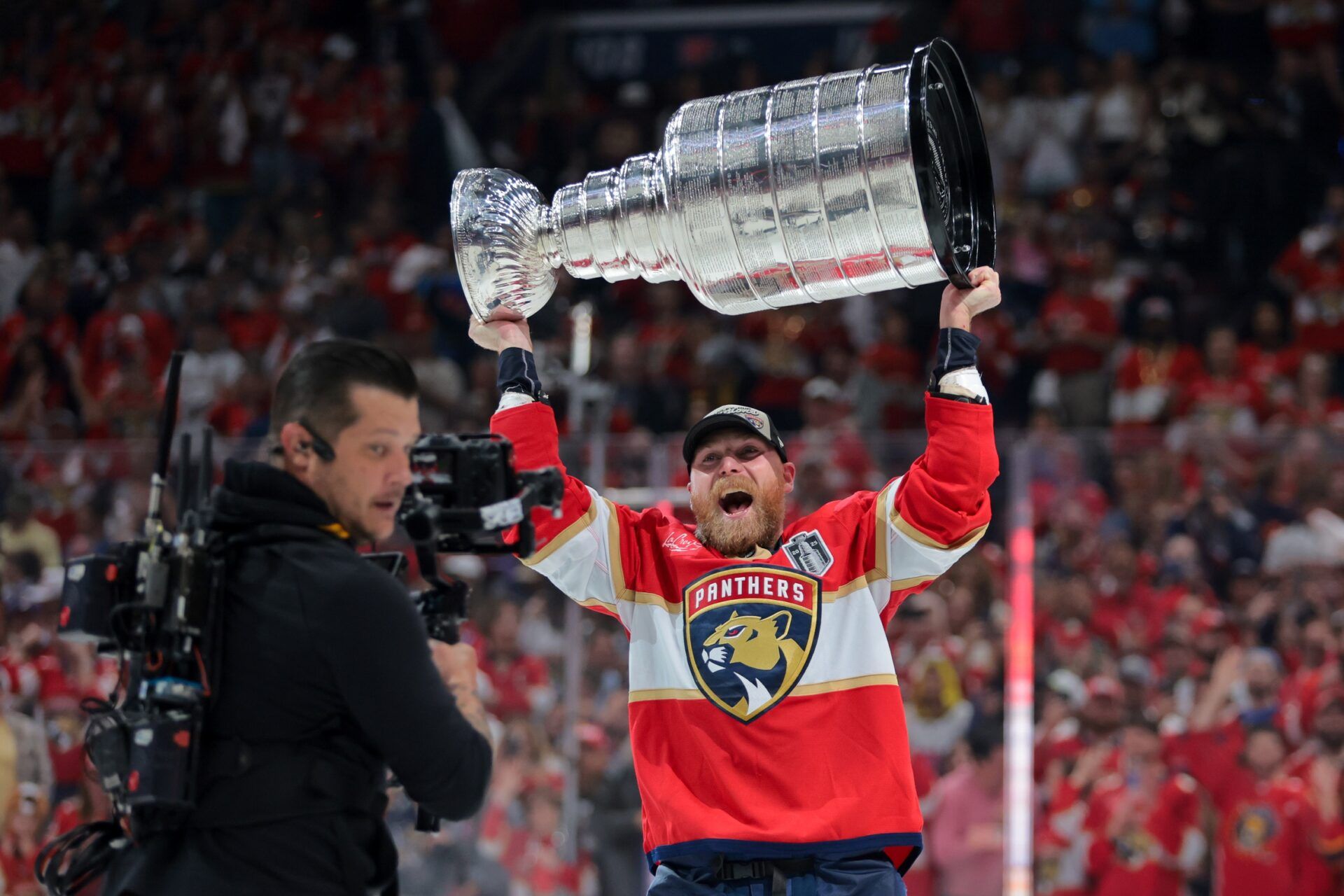 Florida Panthers center Sam Bennett (9) hoists the Stanley Cup after winning game six of the 2025 Stanley Cup Final against the Edmonton Oilers at Amerant Bank Arena.