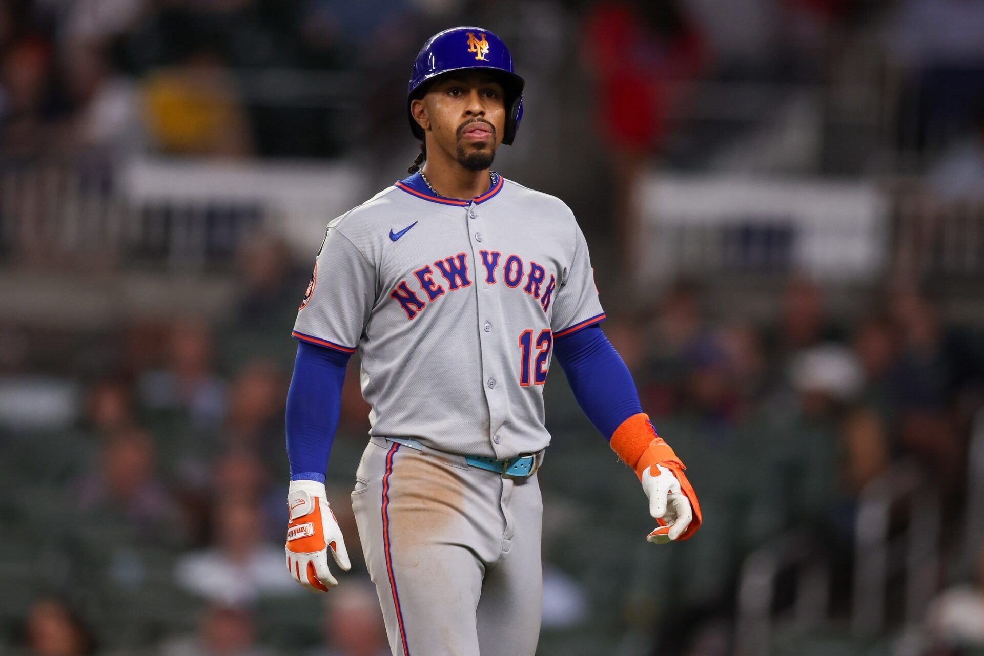 New York Mets shortstop Francisco Lindor (12) walks back to the dugout against the Atlanta Braves in the eighth inning at Truist Park.