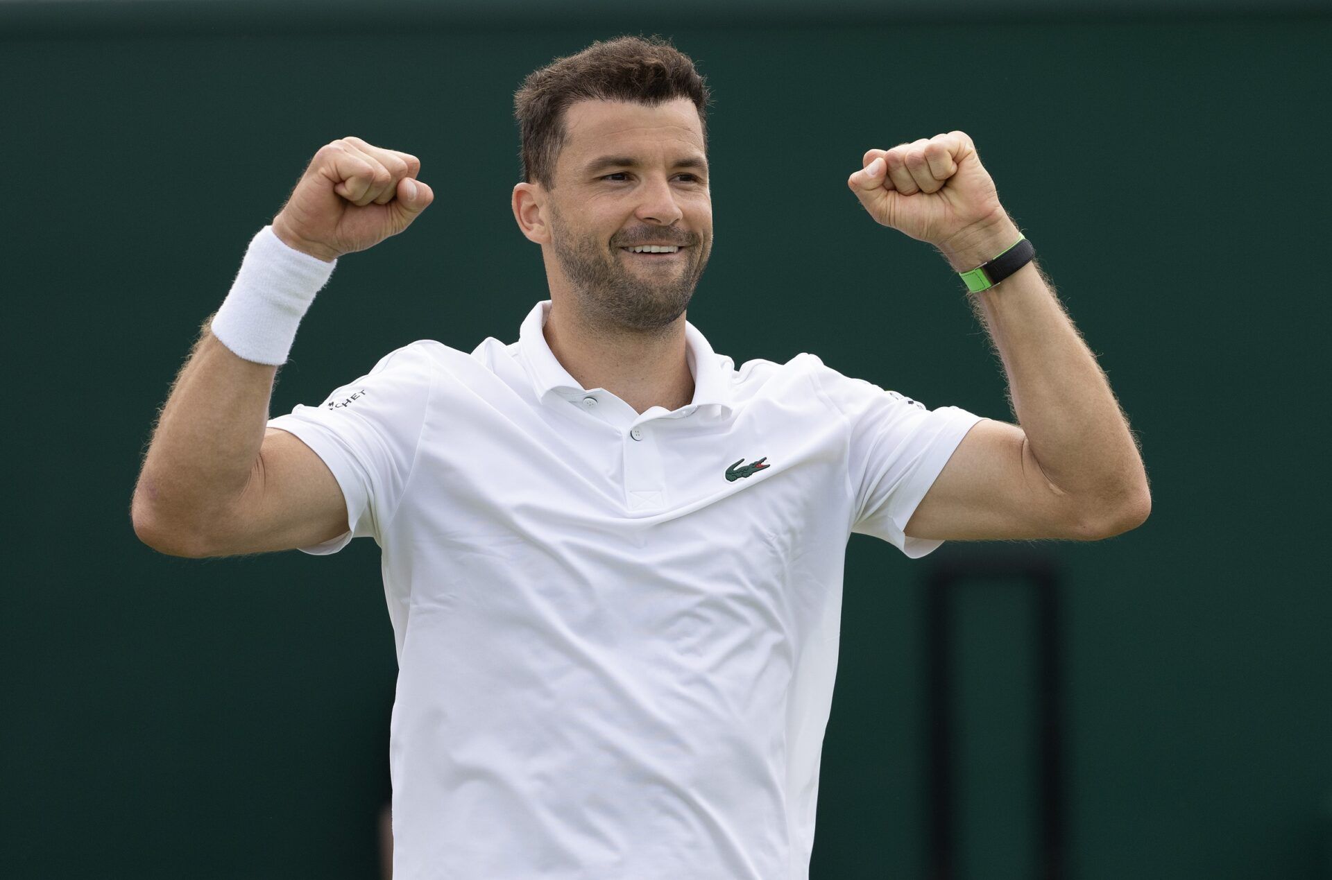 Grigor Dimitrov of Bulgaria celebrates winning his match against Juncheng Shang of China (not shown) on day four of The Championships at All England Lawn Tennis and Croquet Club.