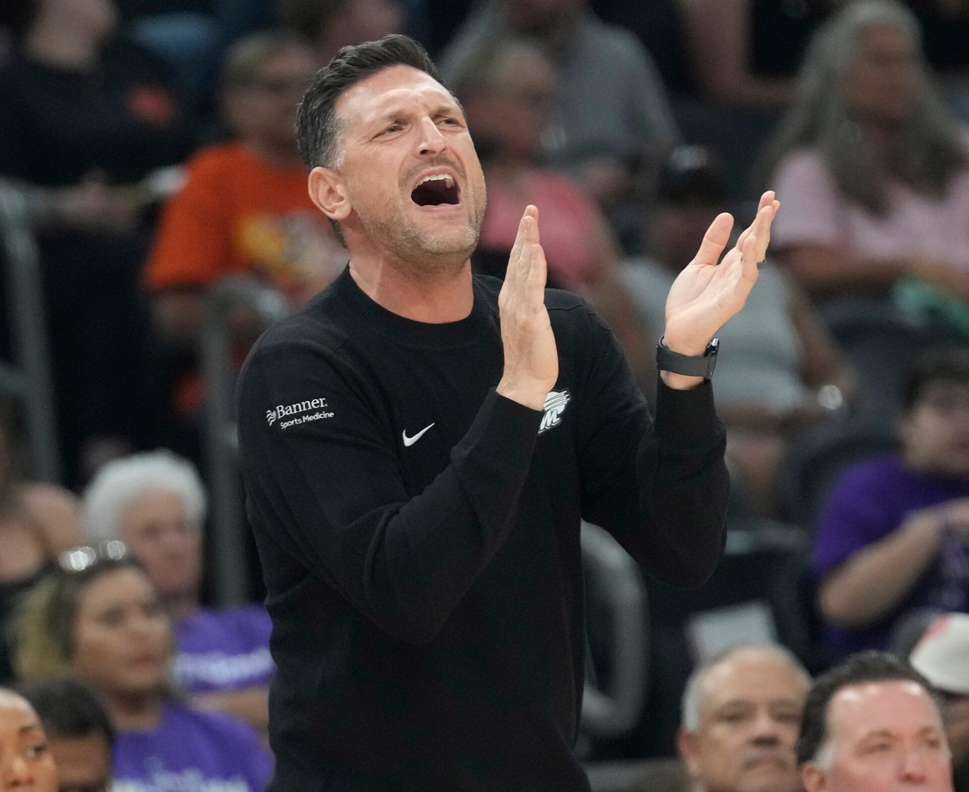 Phoenix Mercury head coach Nate Tibbetts claps for his team against the Chicago Sky during the first quarter at PHX Arena in Phoenix, on May 27, 2025.