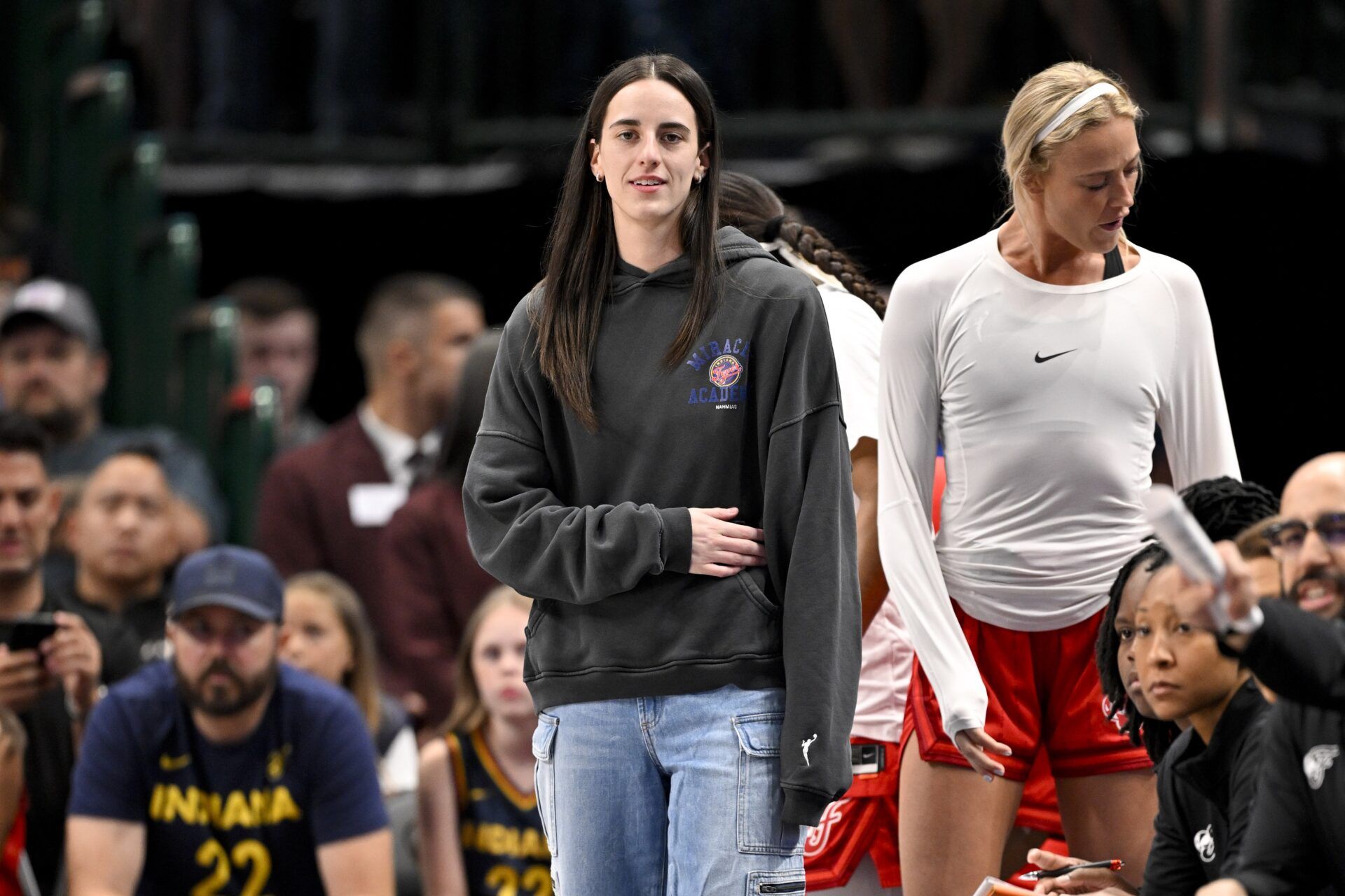 Indiana Fever guard Caitlin Clark (22) looks on from the team bench during the game against the Dallas Wings at the American Airlines Center.