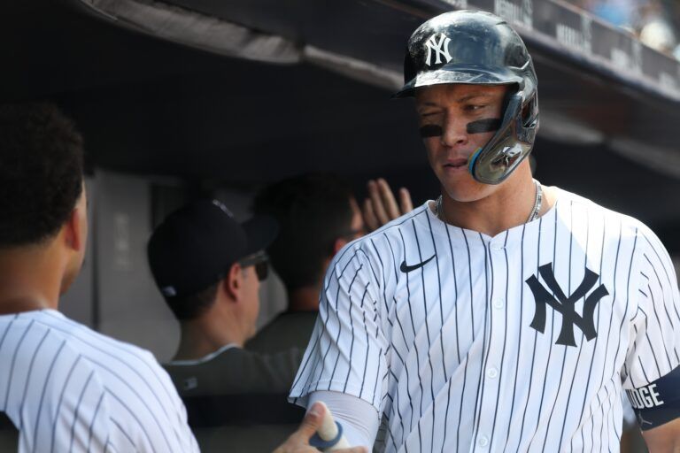 New York Yankees designated hitter Aaron Judge (99) celebrates with teammates after hitting a two run home run during the fourth inning against the Athletics at Yankee Stadium.