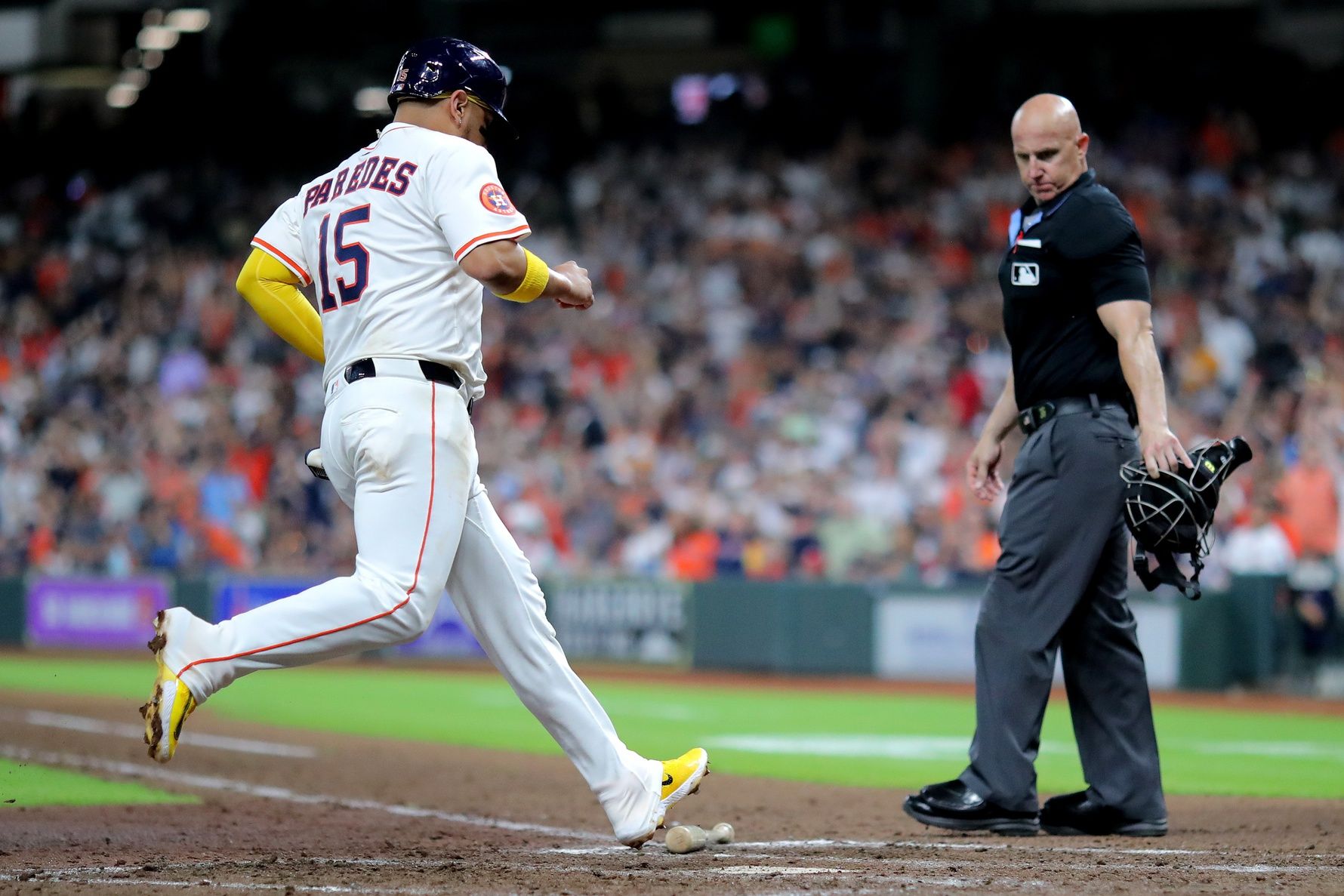 Houston Astros third baseman Isaac Paredes (15) crosses home plate to score a run against the Philadelphia Phillies during the eighth inning at Daikin Park.