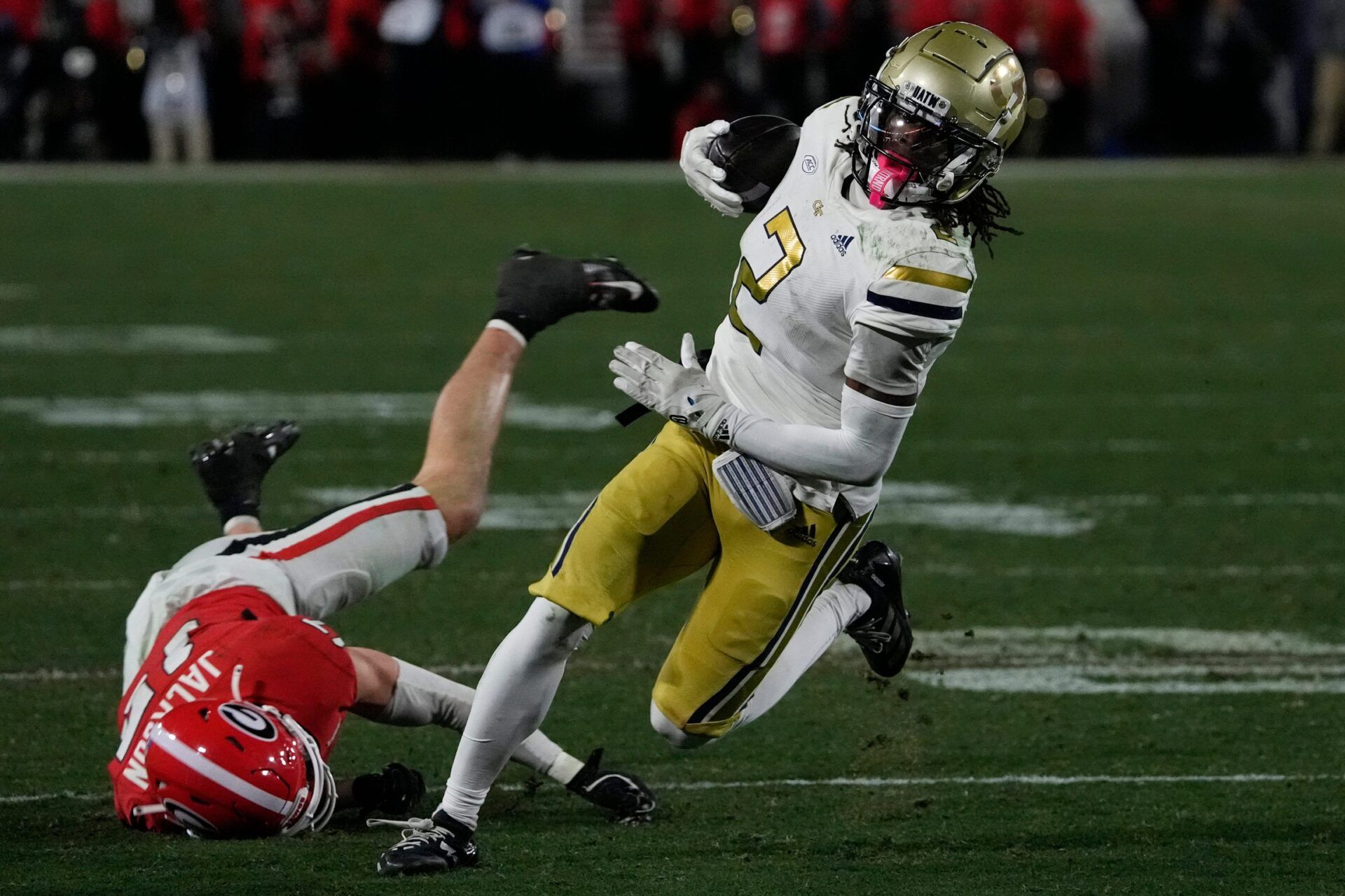 Georgia Tech wide receiver Eric Singleton Jr. (2) moves the ball down the field during the first half of a NCAA college football game against Georgia Tech in Athens, Ga., on Friday, Nov. 29, 2024.