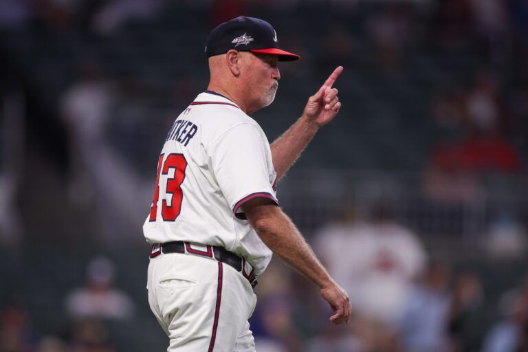 Atlanta Braves manager Brian Snitker (43) makes a pitching change against the Arizona Diamondbacks in the ninth inning at Truist Park.