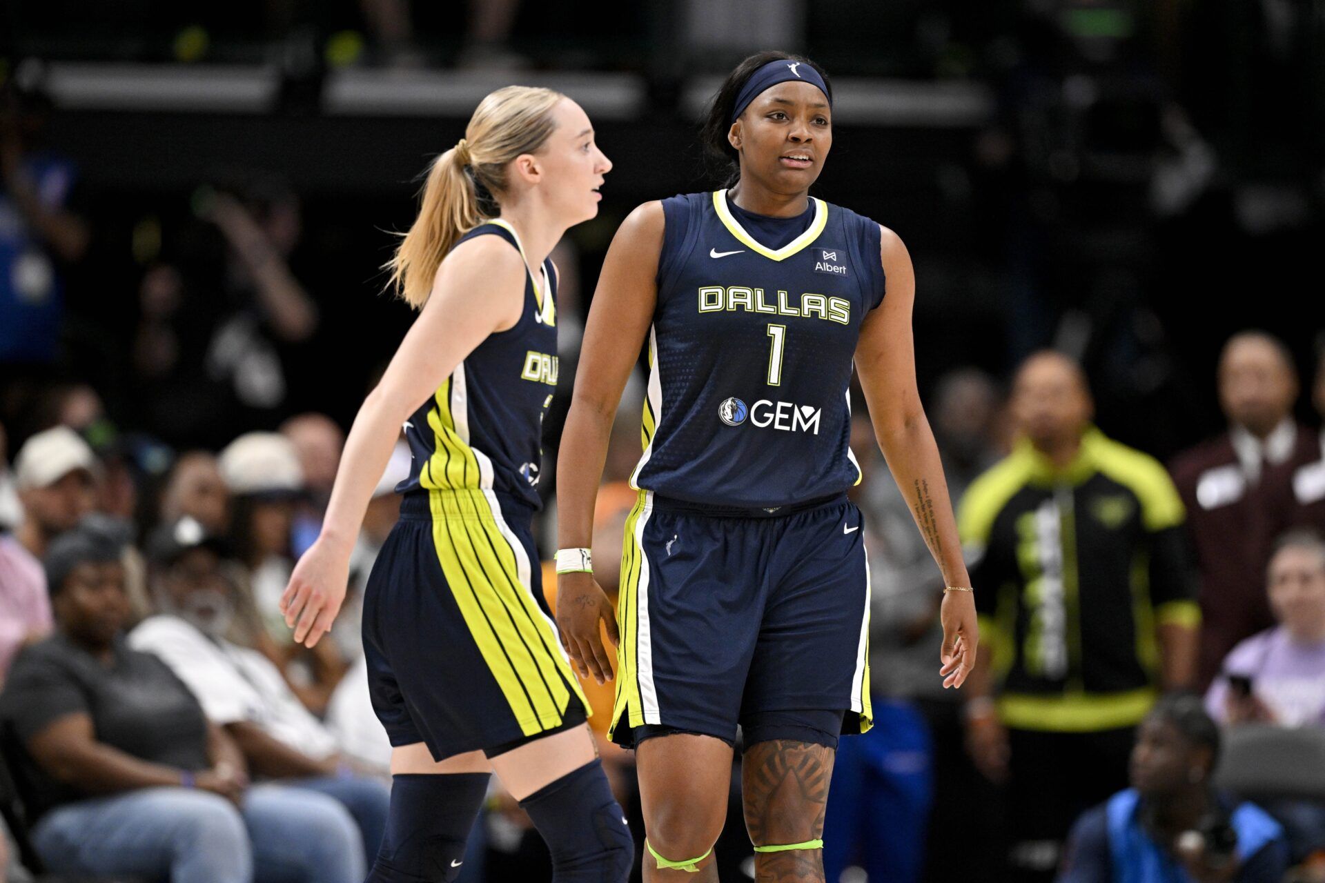 Dallas Wings guard Paige Bueckers (5) and forward NaLyssa Smith (1) in action during the game between the Dallas Wings and the Indiana Fever at the American Airlines Center.