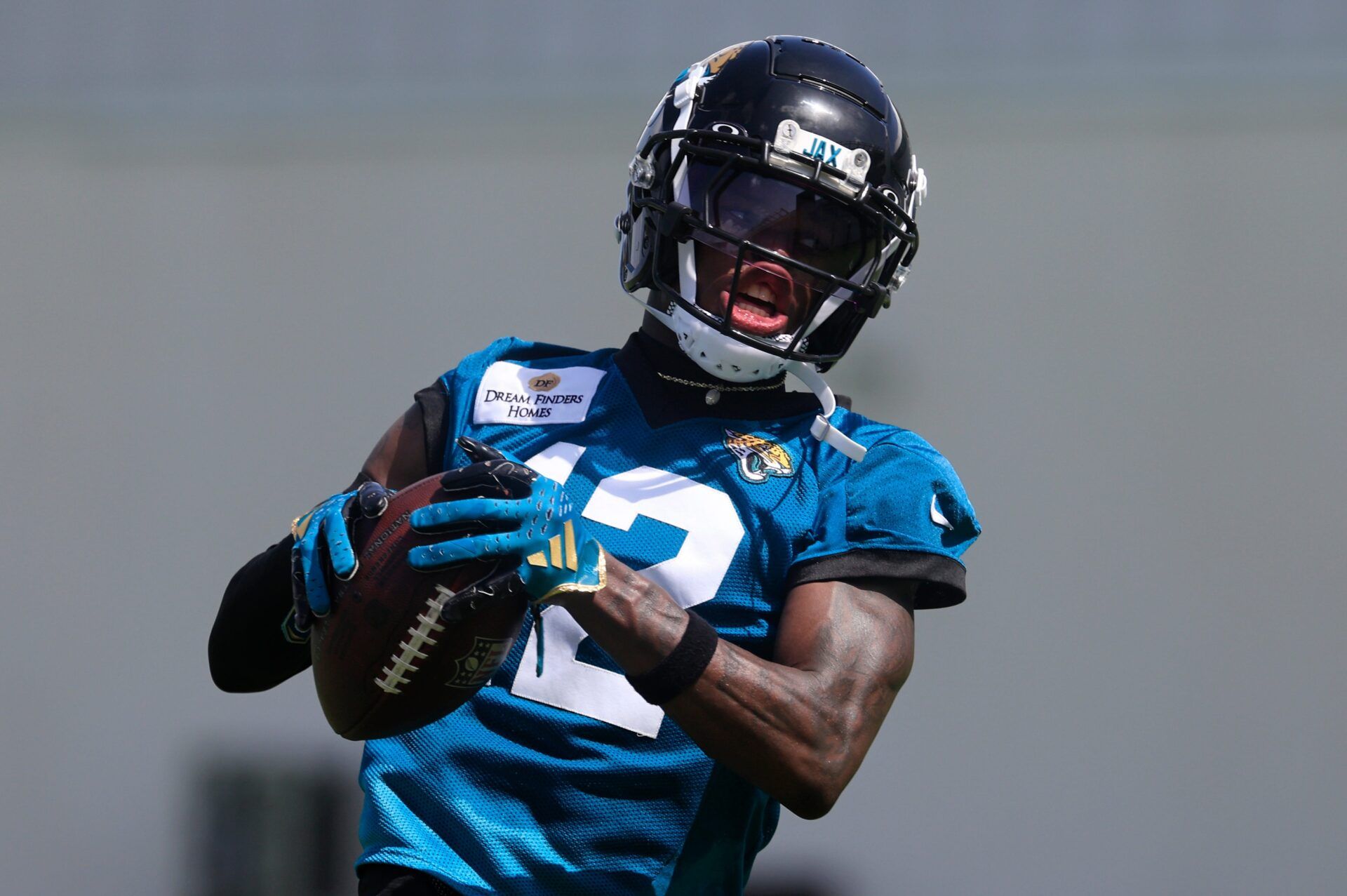 Jacksonville Jaguars wide receiver Travis Hunter (12) catches a pass from quarterback Trevor Lawrence (16), not shown, during the 10th organized team activity at Miller Electric Center Wednesday, June 4, 2025 in Jacksonville, Fla. [Corey Perrine/Florida Times-Union]