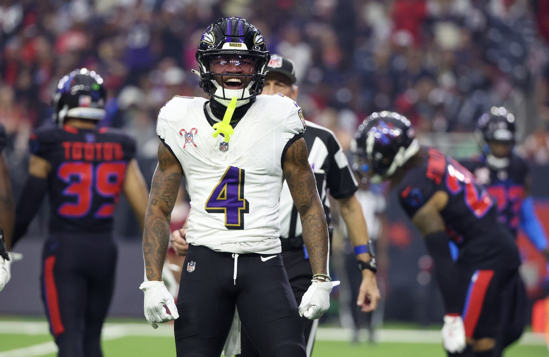 Baltimore Ravens wide receiver Zay Flowers (4) reacts after his first down catch against the Houston Texans  in the first quarter at NRG Stadium.