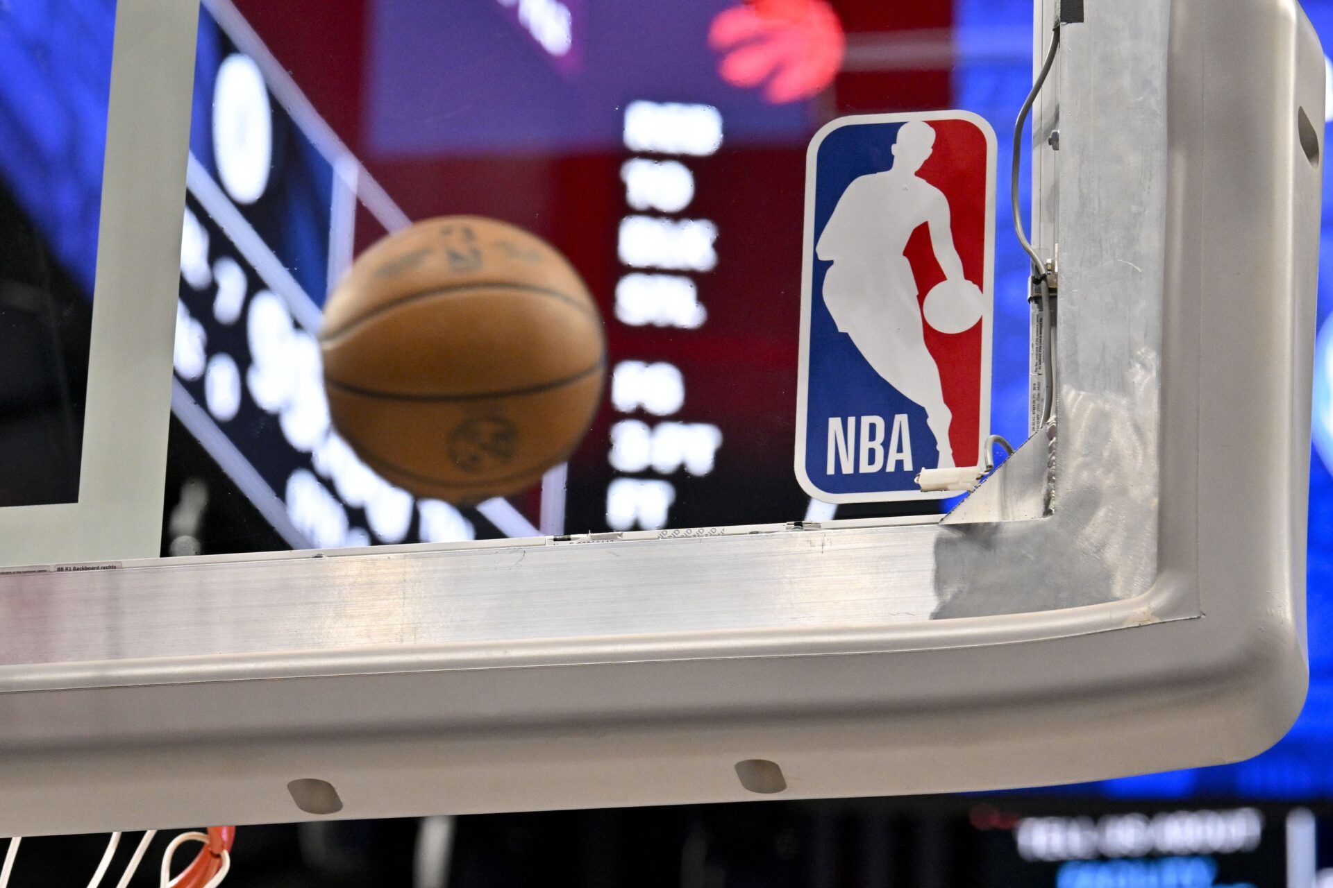 A view of an NBA basketball and backyard and NBA logo before the game between the Dallas Mavericks and the Toronto Raptors at the American Airlines Center.