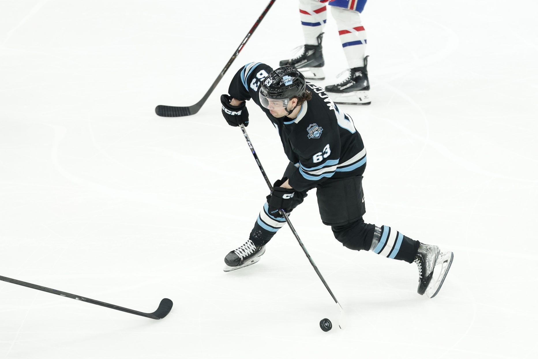 Utah Hockey Club left wing Matias Maccelli (63) shoots the puck during the second period against the Montreal Canadiens at Delta Center.