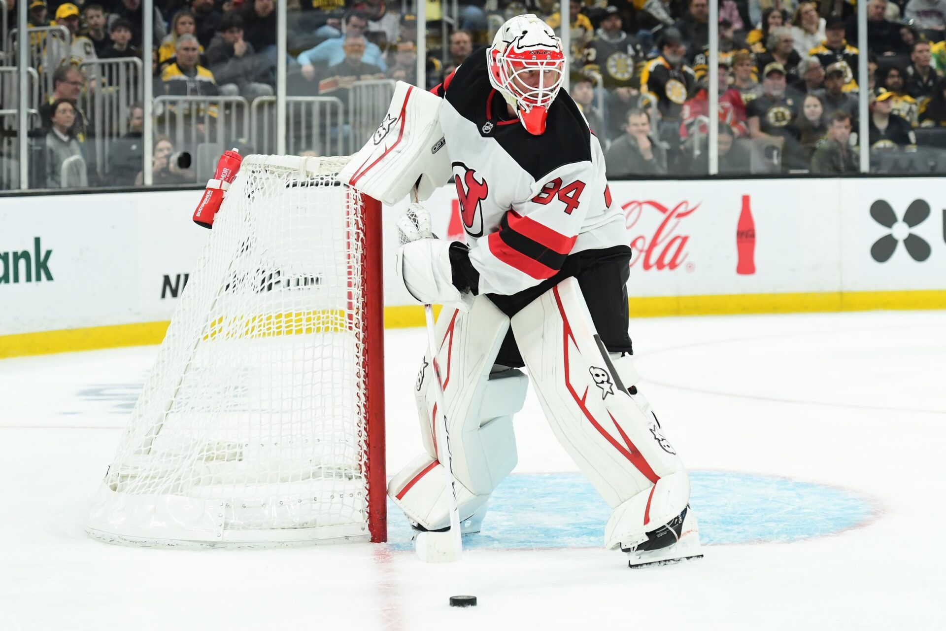 New Jersey Devils goaltender Jake Allen (34) handles the puck during the third period against the Boston Bruins at TD Garden.