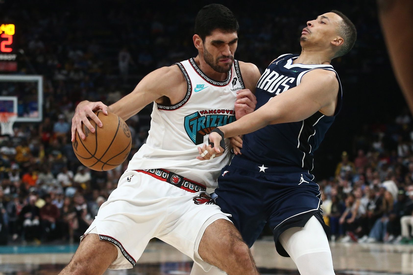 Memphis Grizzlies forward Santi Aldama (7) drives to the basket as Dallas Mavericks guard Dante Exum (0) defends during the third quarter at FedExForum.