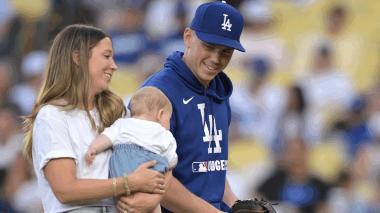 Los Angeles Dodgers catcher Will Smith (16) with his wife Cara holding son Layton and daughter Charlotte on his bobblehead night at Dodger Stadium.