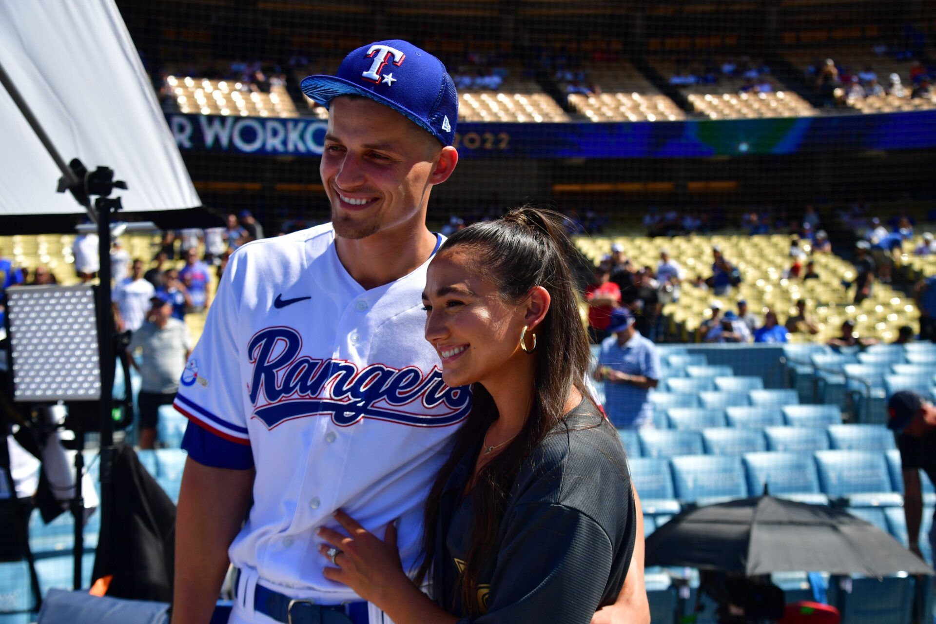 Texas Rangers shortstop Corey Seager (5) poses for a photograph with wife Madisyn during batting practice at Dodger Stadium.