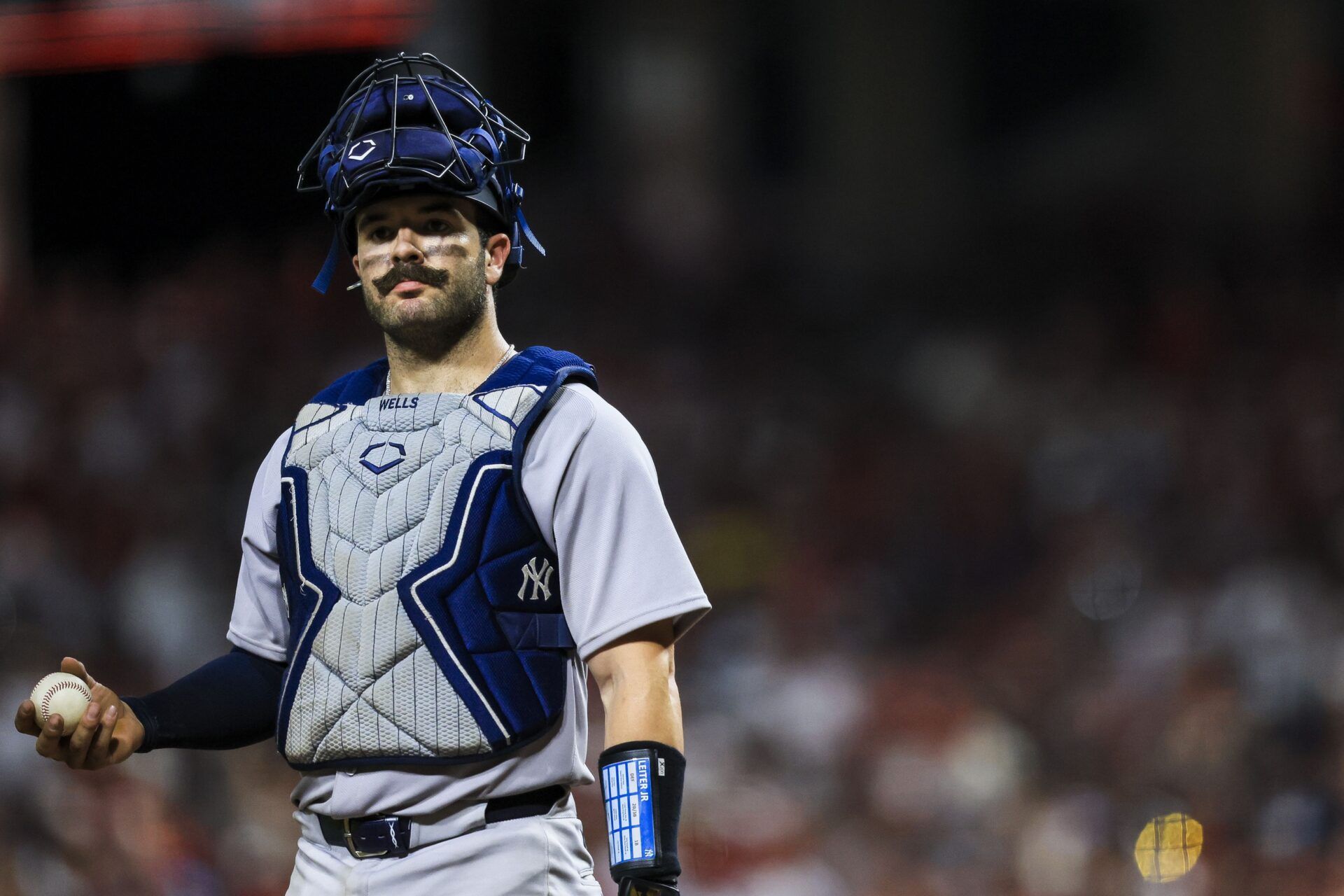 New York Yankees catcher Austin Wells (28) stands on the field during a stop in play in the eleventh inning against the Cincinnati Reds at Great American Ball Park.