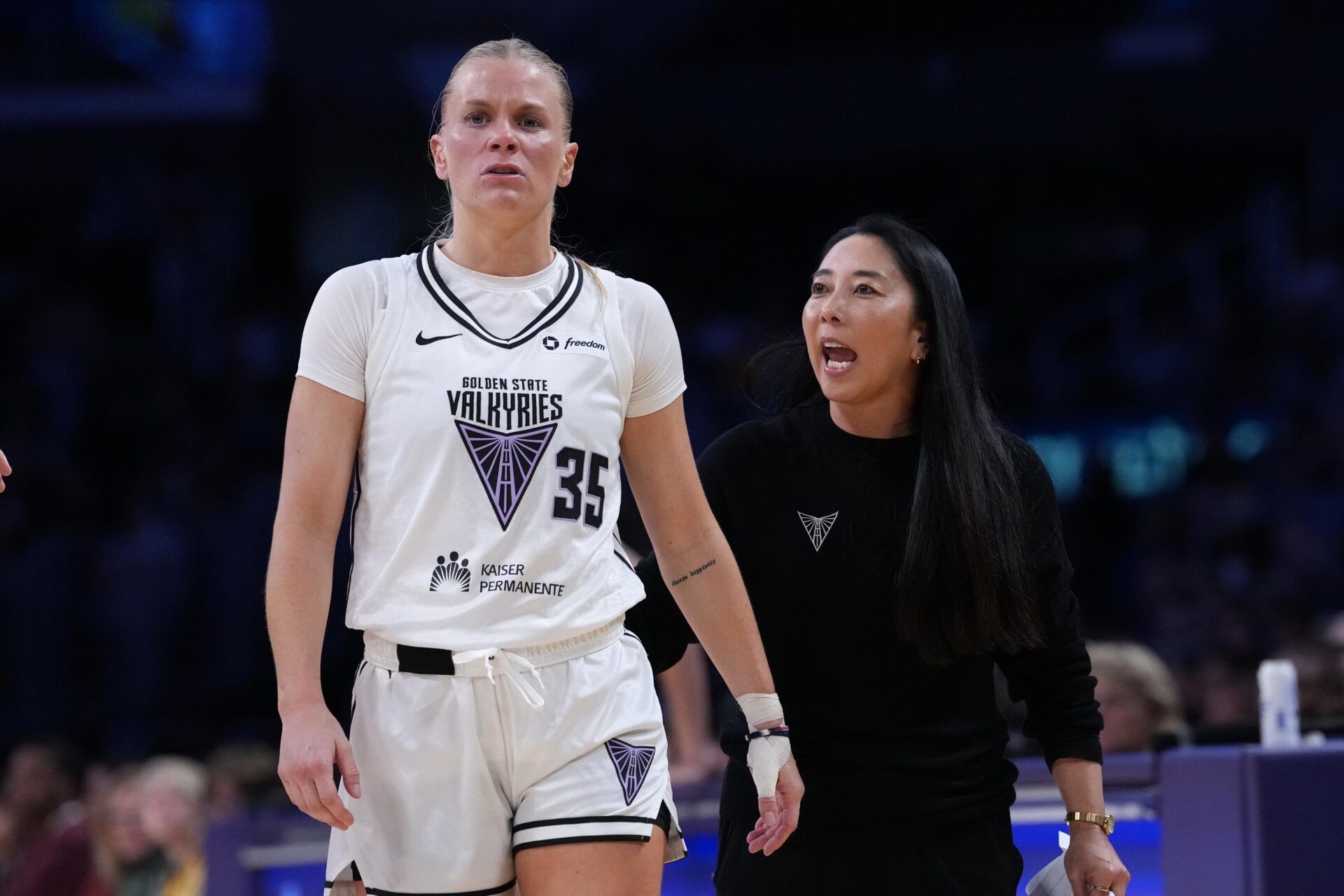 Golden State Valkyries coach Natalie Nakase (right) talks with guard Julie Vanloo (35) in the first half against the LA Sparks at Crypto.com Arena.