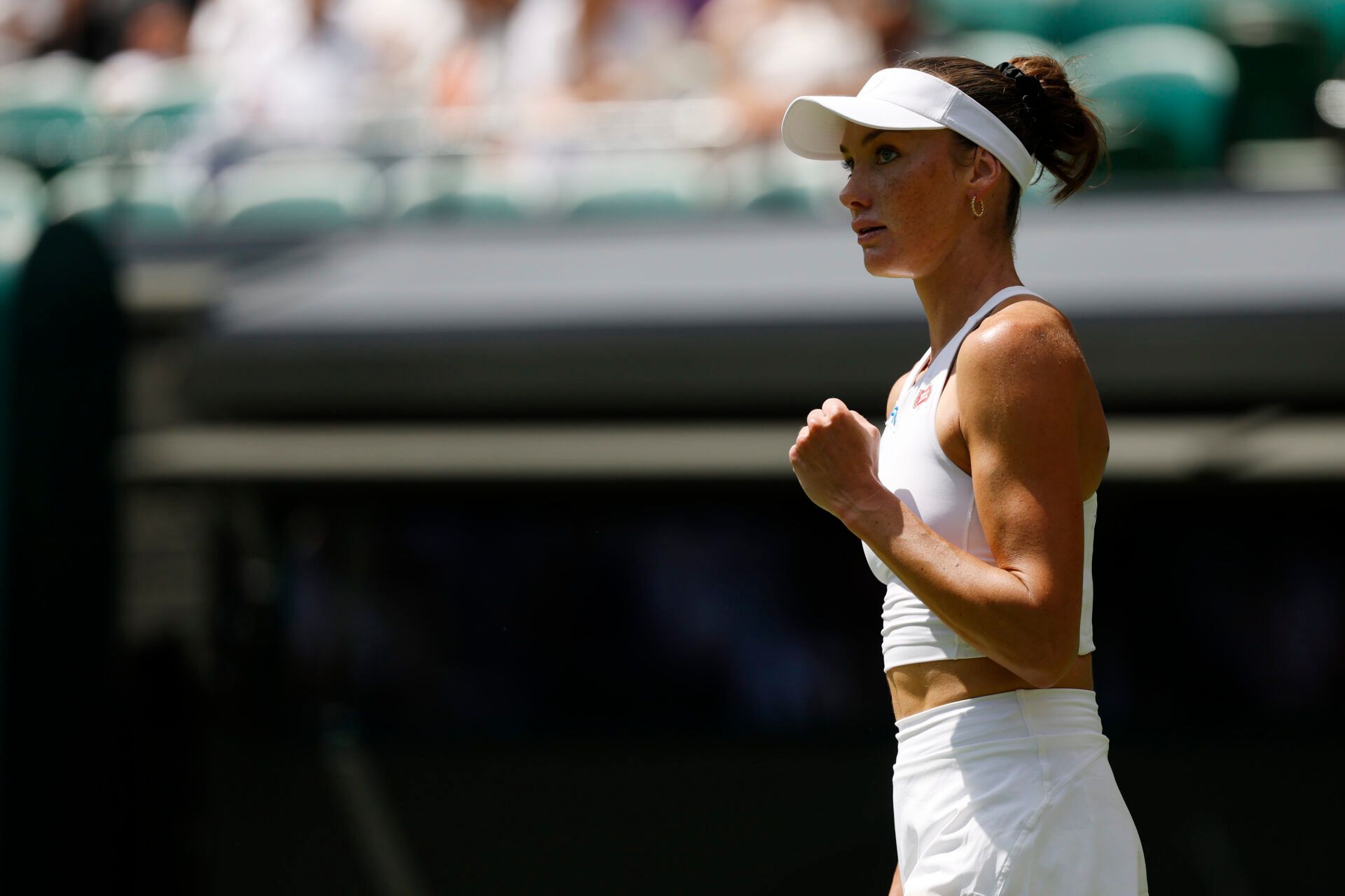 Carson Branstine (CAN) reacts after winning a game against Aryna Sabalenka (not pictured) on day one of The Championships, Wimbledon 2025 at All England Lawn Tennis and Croquet Club.