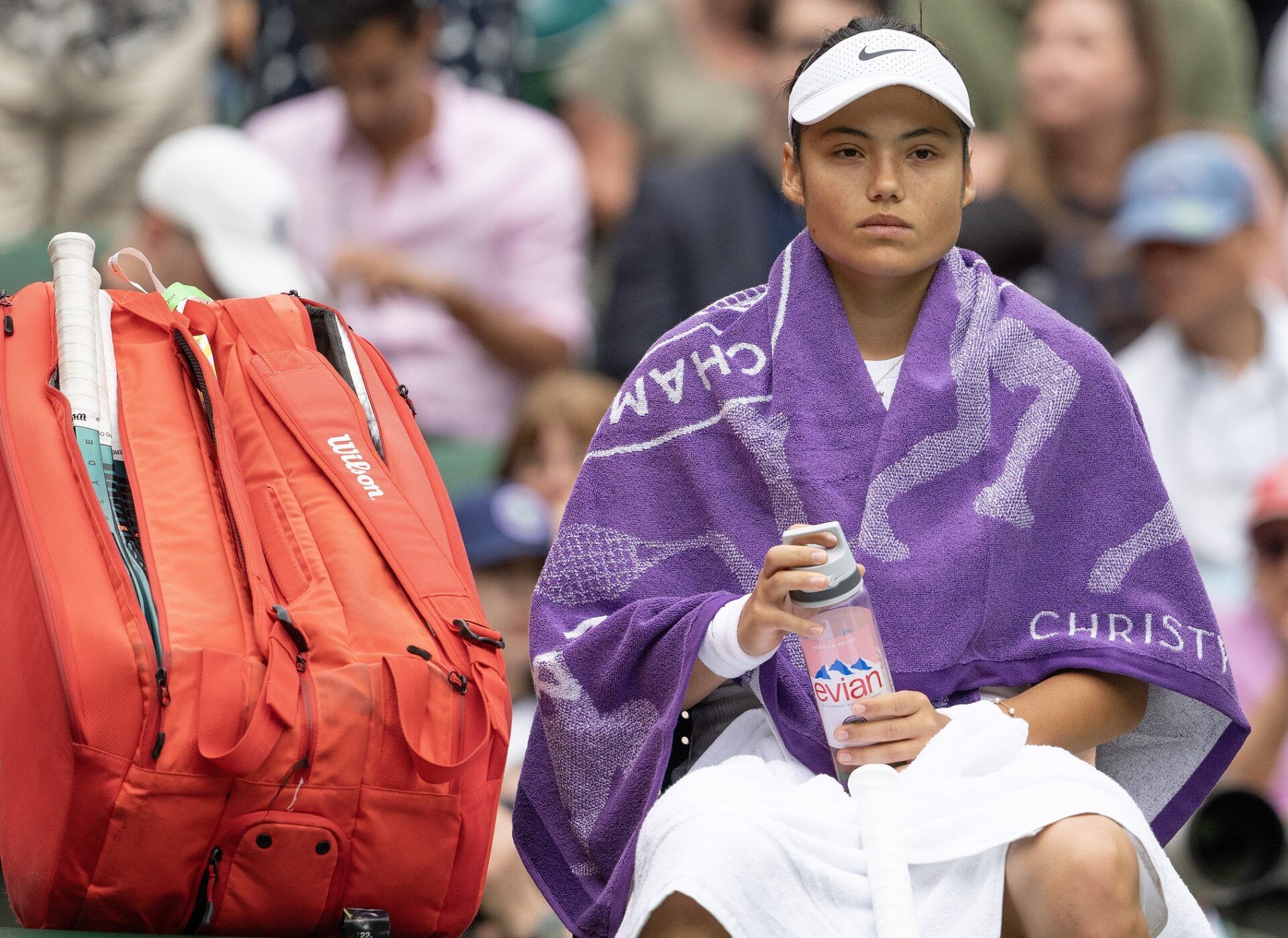 Emma Raducanu of Great Britain at a change of ends during her match against Renata Zarazua of Mexico (not shown) on day one of The Championships at All England Lawn Tennis and Croquet Club.