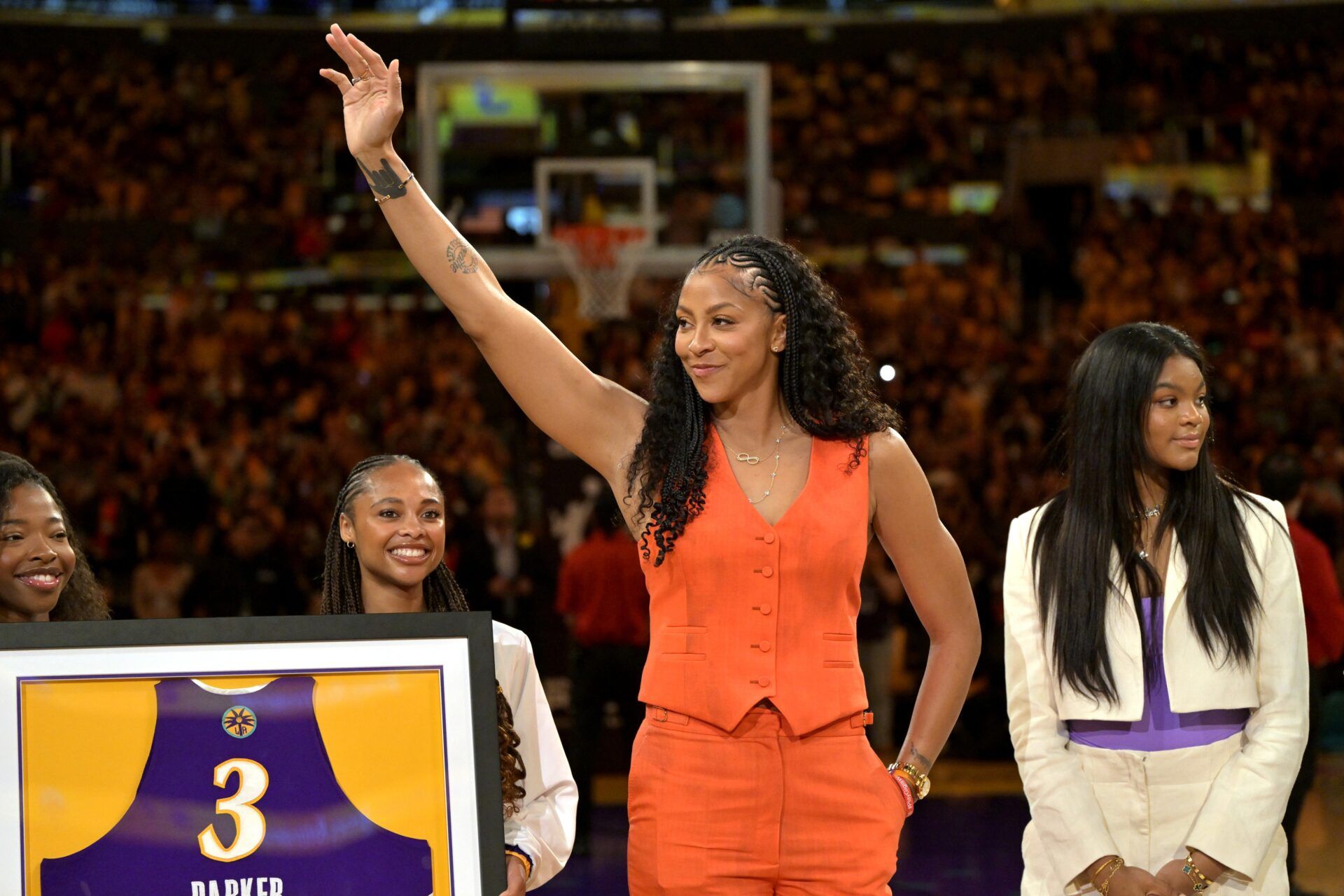 Former Los Angeles Sparks Candace Parker acknowledges the crowd during a  jersey retirement ceremony at halftime at Crypto.com Arena.