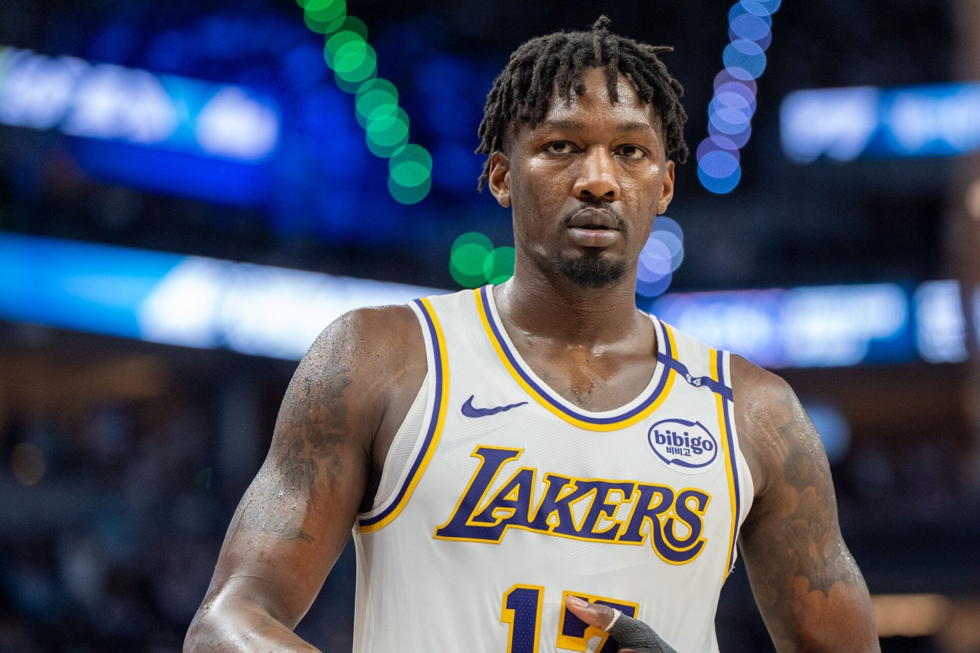 Los Angeles Lakers forward Dorian Finney-Smith (17) heads to the sidelines to inbound the ball against the Minnesota Timberwolves in the third quarter during game four of first round for the 2025 NBA Playoffs at Target Center.